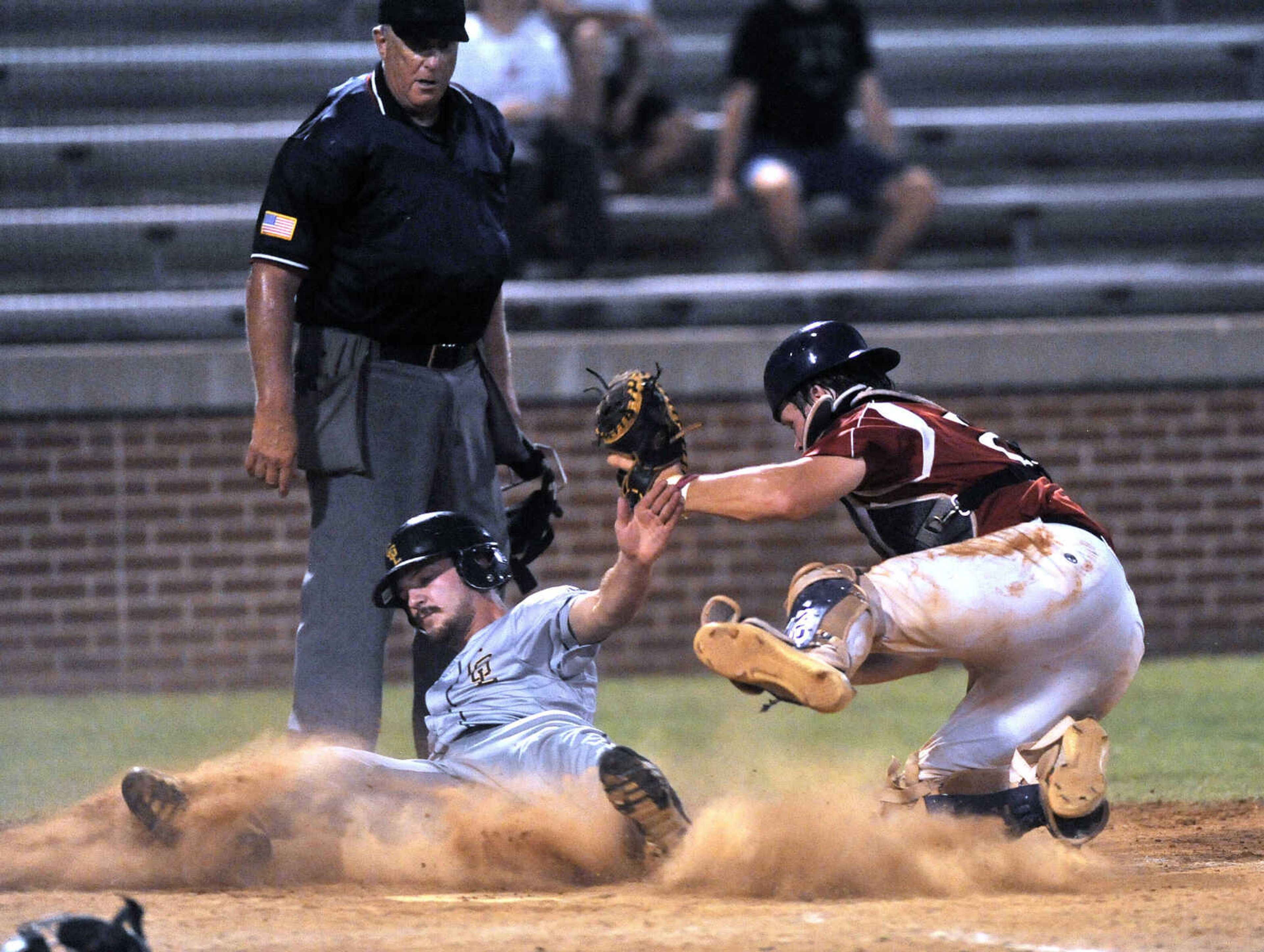 FRED LYNCH ~ flynch@semissourian.com
Cape Girardeau Post 63's Derek Kirn is tagged out at the plate by Jackson Post 158 catcher Braden Dobbs during the sixth inning of a semifinal in the Senior Legion District Tournament Friday, July 13, 2018 in Sikeston, Missouri.