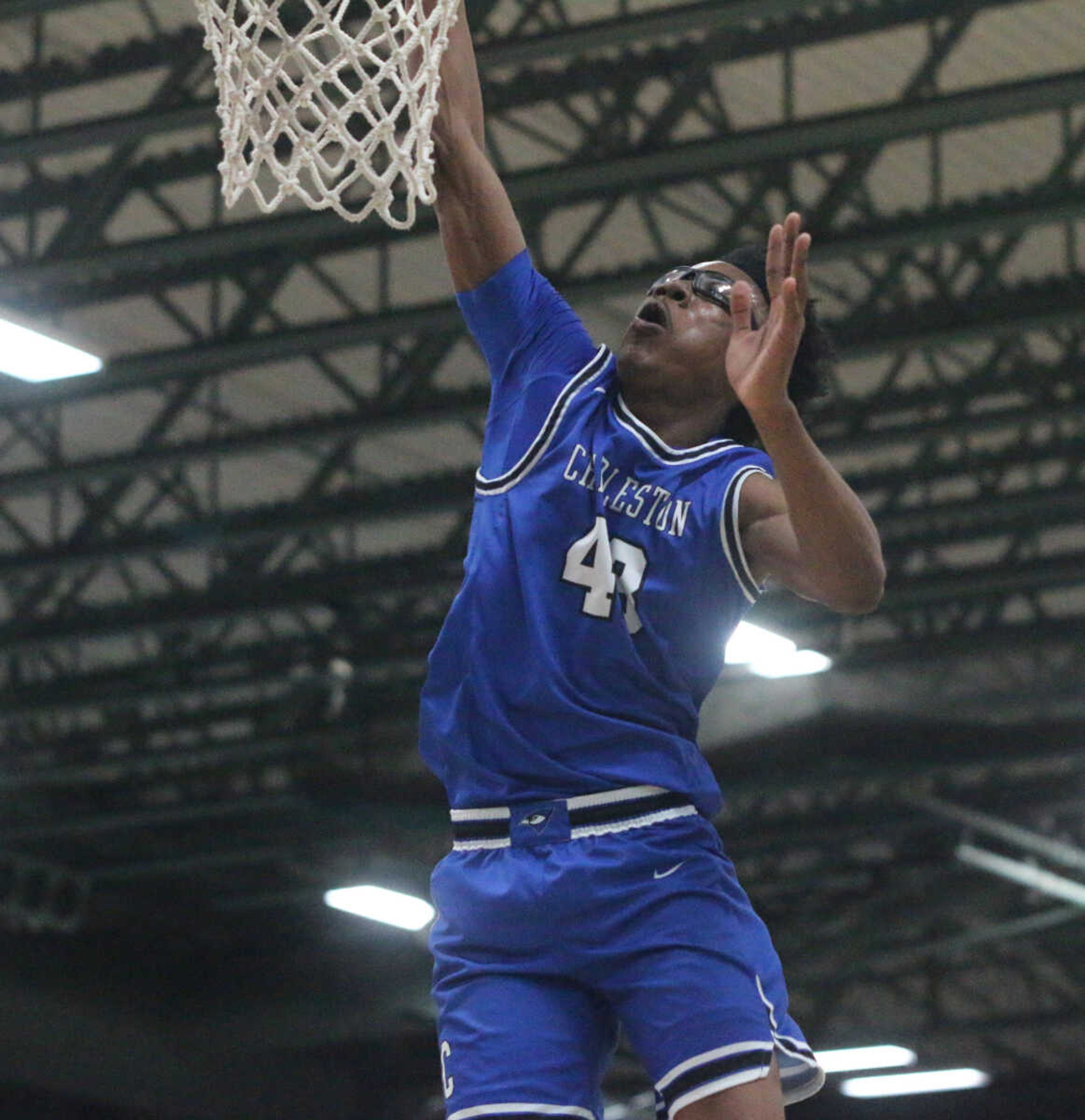 Rico Coleman goes for a one-handed jam during Charleston's 74-61 win over Bishop DuBourg in a Class 3 quarterfinal at the Farmington Community Civic Center on Saturday, March 5. (Dennis Marshall/Standard-Democrat)