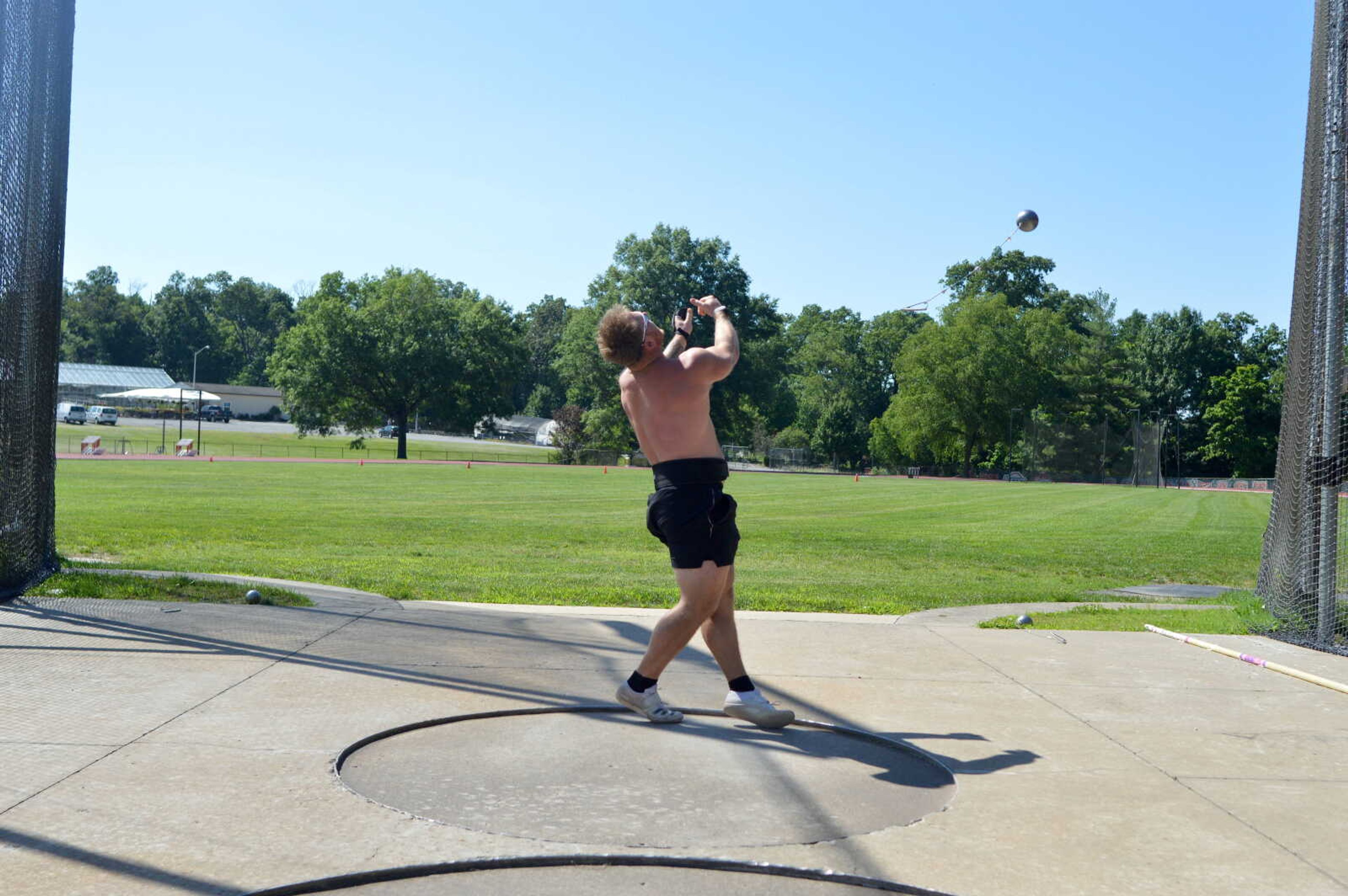 Southeast Missouri State alum Logan Blomquist practices his hammer throw technique Thursday, June 13, at the Abe Stuber Track Complex in Cape Girardeau. 