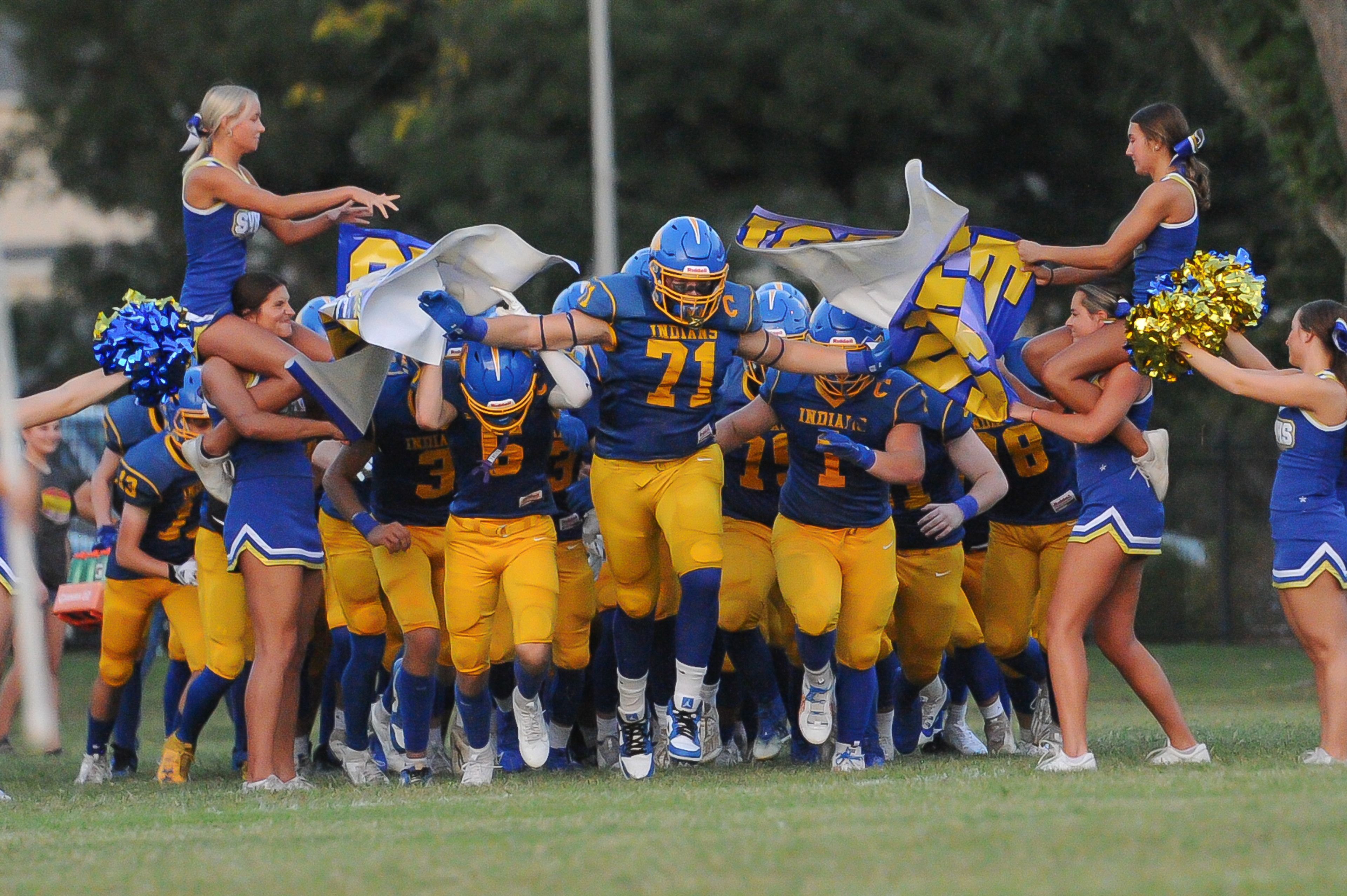 St. Vincent's Boston Tarrillion (center) leads the charge before a Friday, September 20, 2024 game between the St. Vincent Indians and the Herculaneum Blackcats at St. Vincent High School in Perryville, Mo. St. Vincent defeated Herculaneum, 47-7.