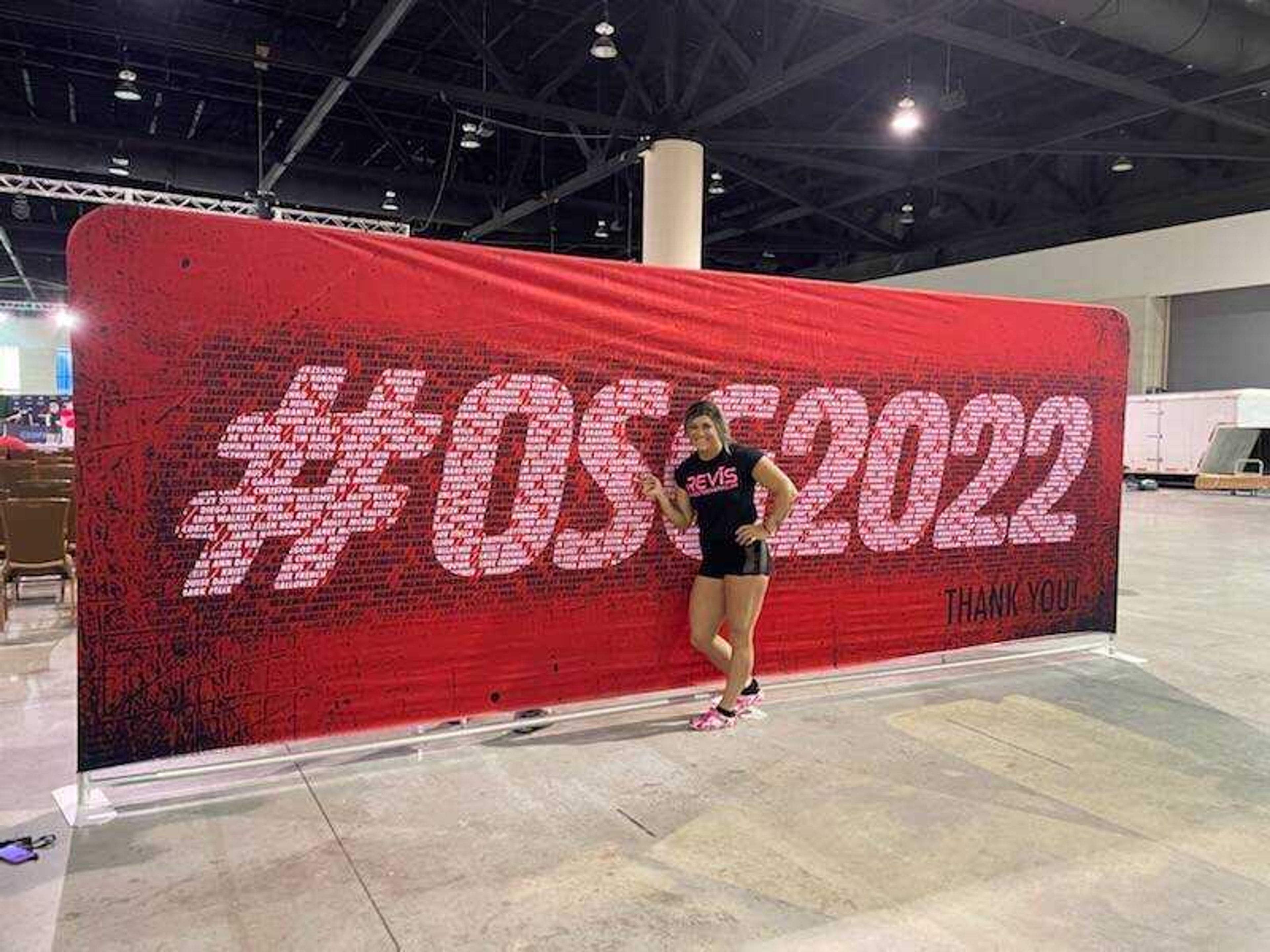 Chelsea Pullen poses next to her name on the Official Strongman Games banner during the competition at Daytona Beach, Florida. 