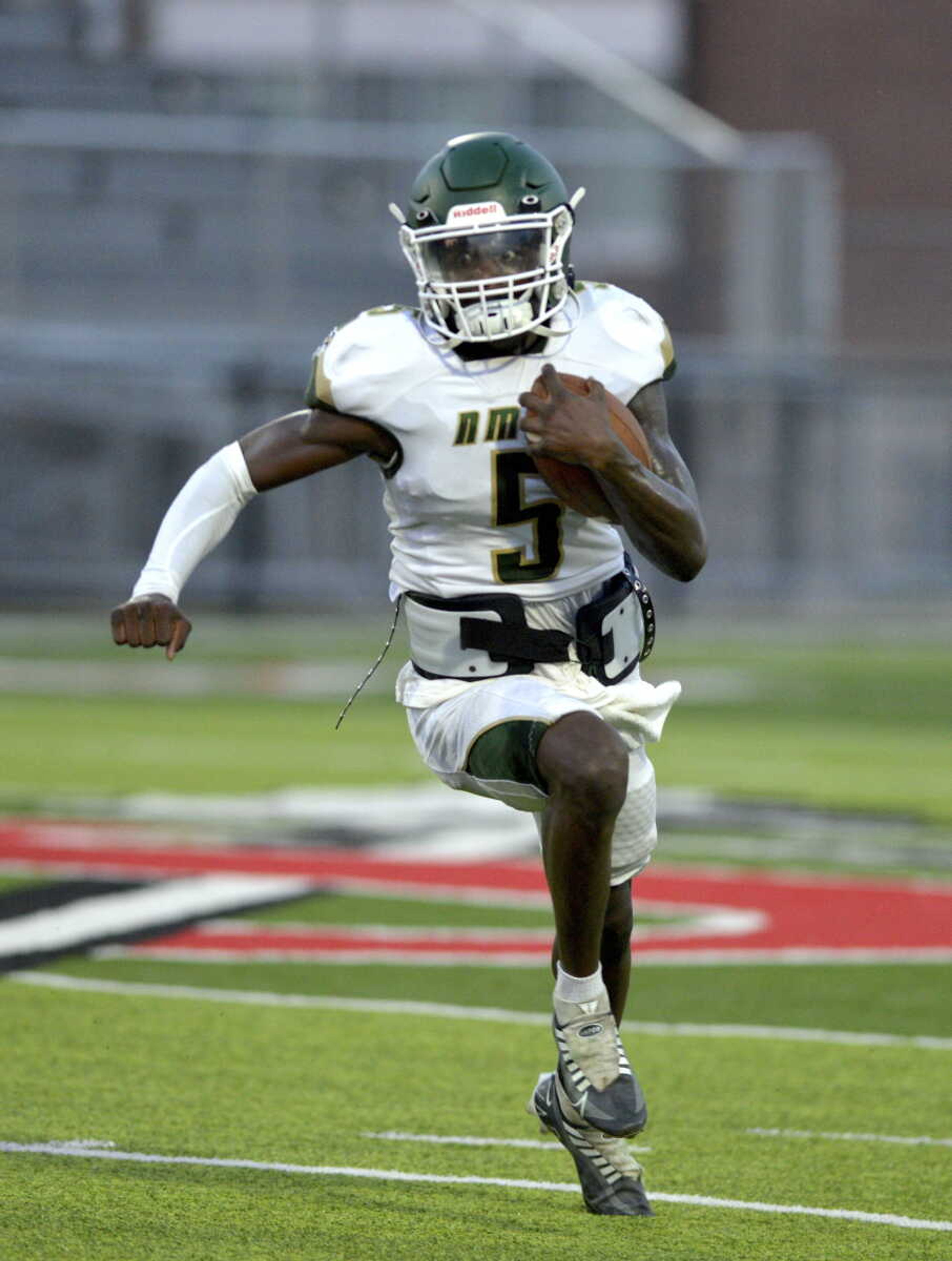 NMCC's BJ Williamson (5) run for a big gain during a scrimmage at Jackson High School earlier this summer.