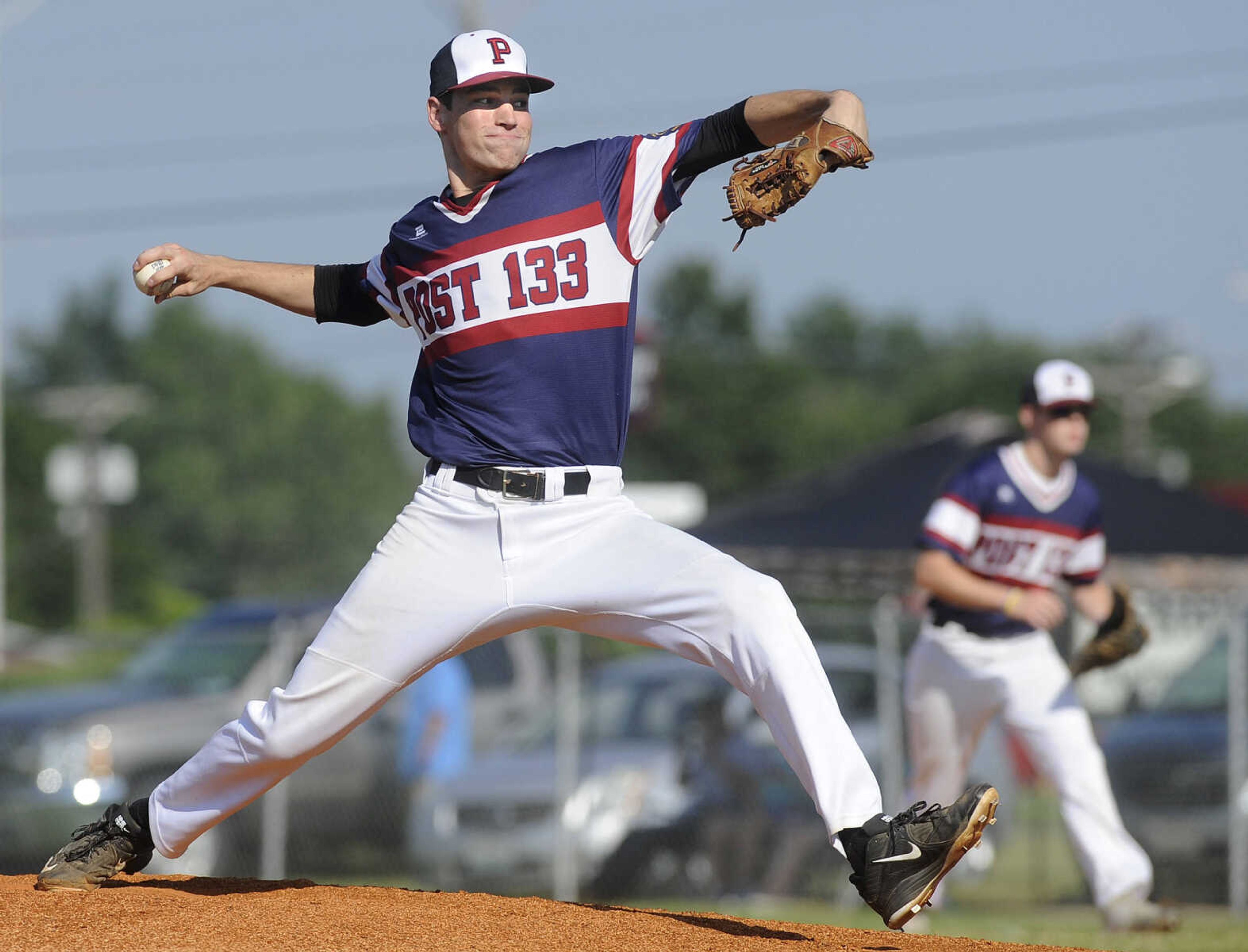 FRED LYNCH ~ flynch@semissourian.com
Perryville Post 133 starter Chase Brown pitches to a Cape Girardeau Post 63 batter during the first inning of a quarterfinal in the Senior Legion District Tournament Thursday, July 12, 2018 in Sikeston, Missouri.