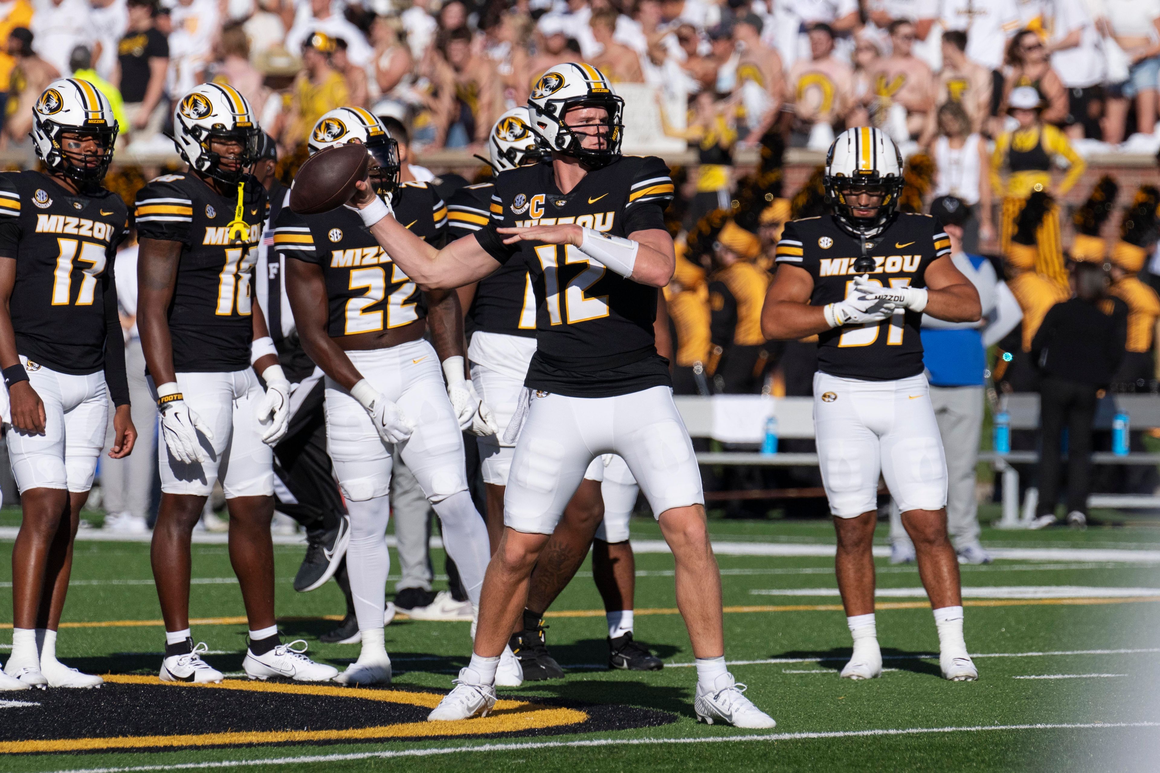 Missouri quarterback Brady Cook (12) warms up before an NCAA college football game against Buffalo, Saturday, Sept. 7, 2024, in Columbia, Mo. (AP Photo/L.G. Patterson)