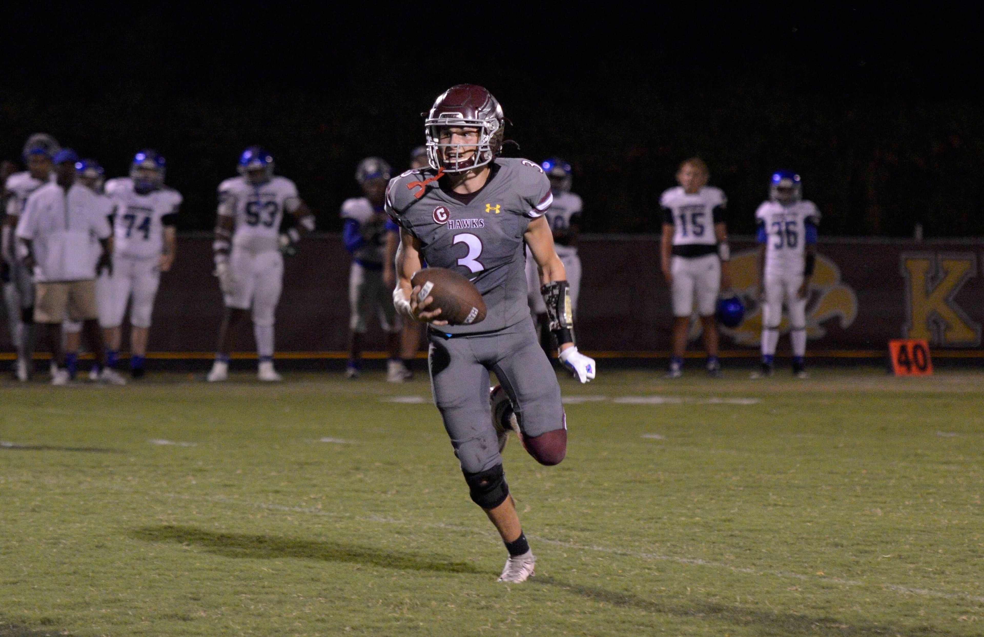 Kelly quarterback Skyler Still carries the ball against Charleston on Friday, August 30, in Benton, Mo. 