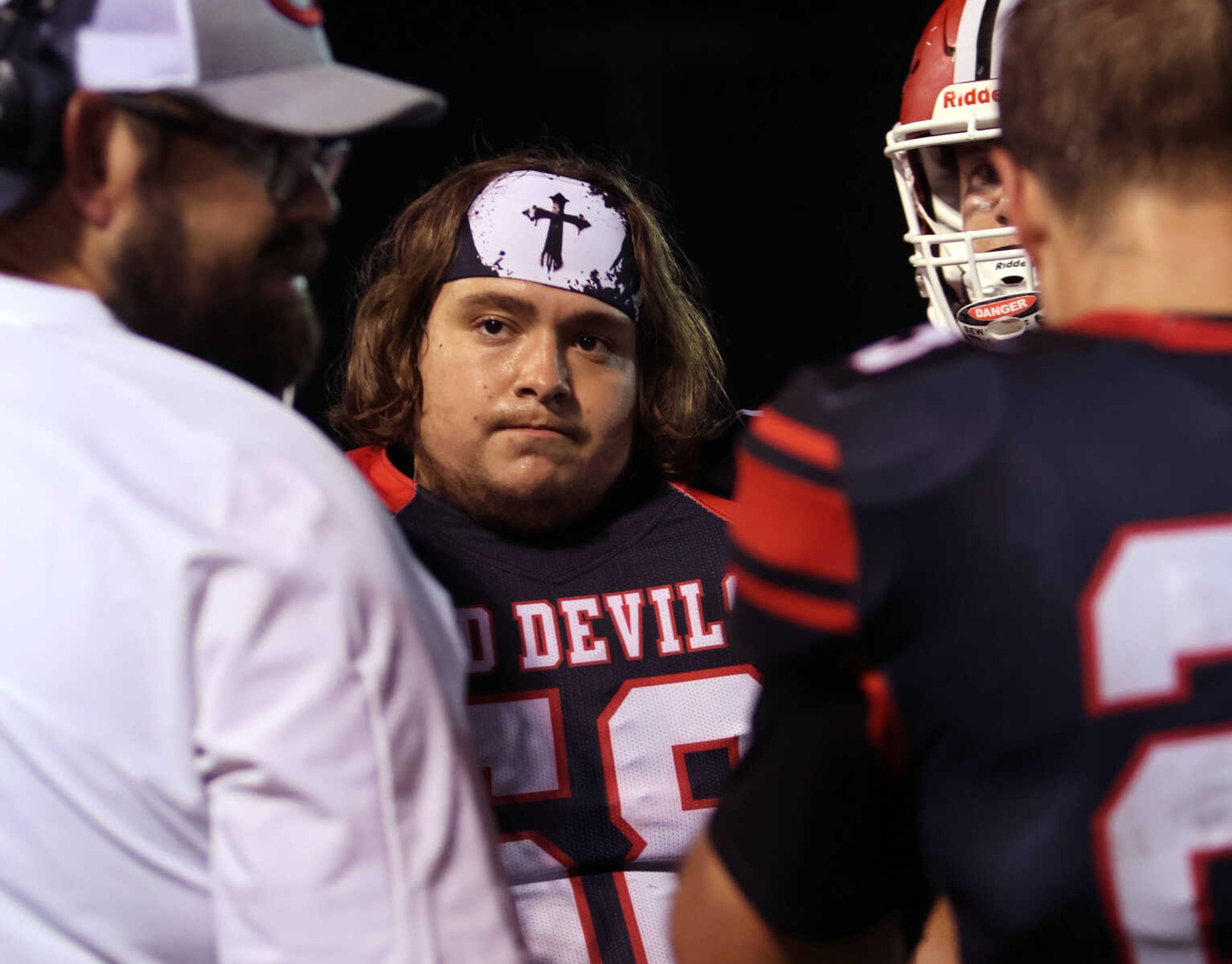 Chaffee's Braden Wicker listens to assistant coach Andy Cannon on the sidelines during Friday night's game against Kelly at Chaffee High School. 