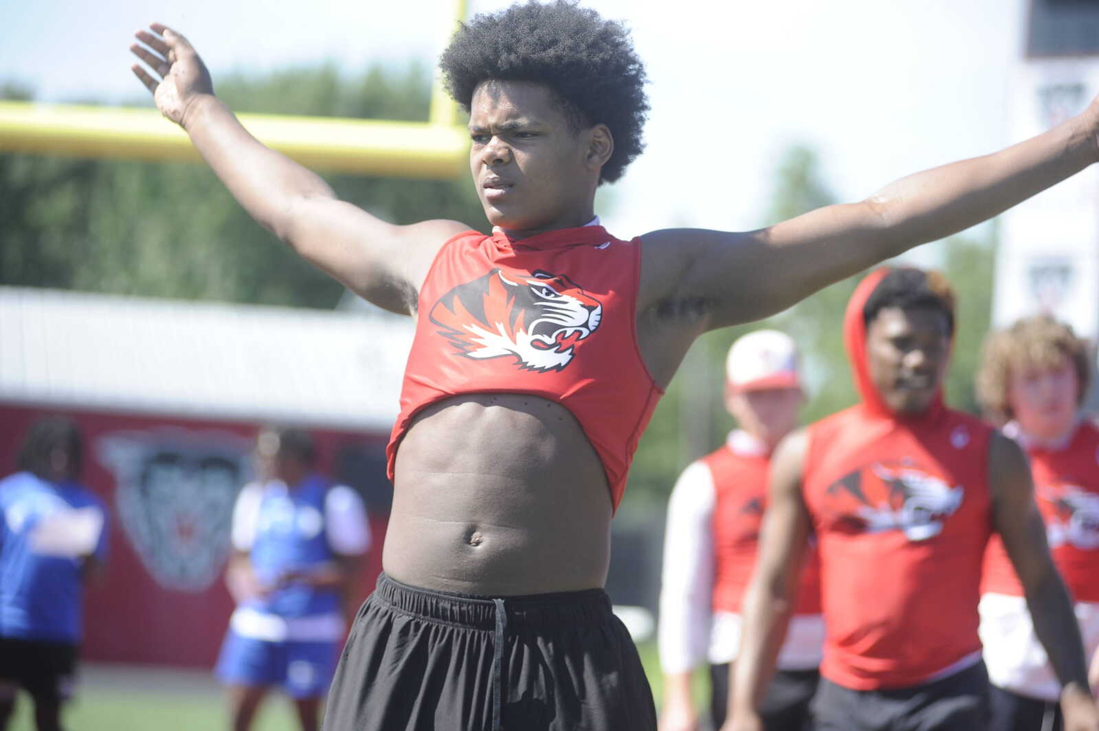 Caruthersville High School sophomore football player Tre'sean Mays gets upright after landing during a broad jump test at the recent football Combine session at Dexter High School.