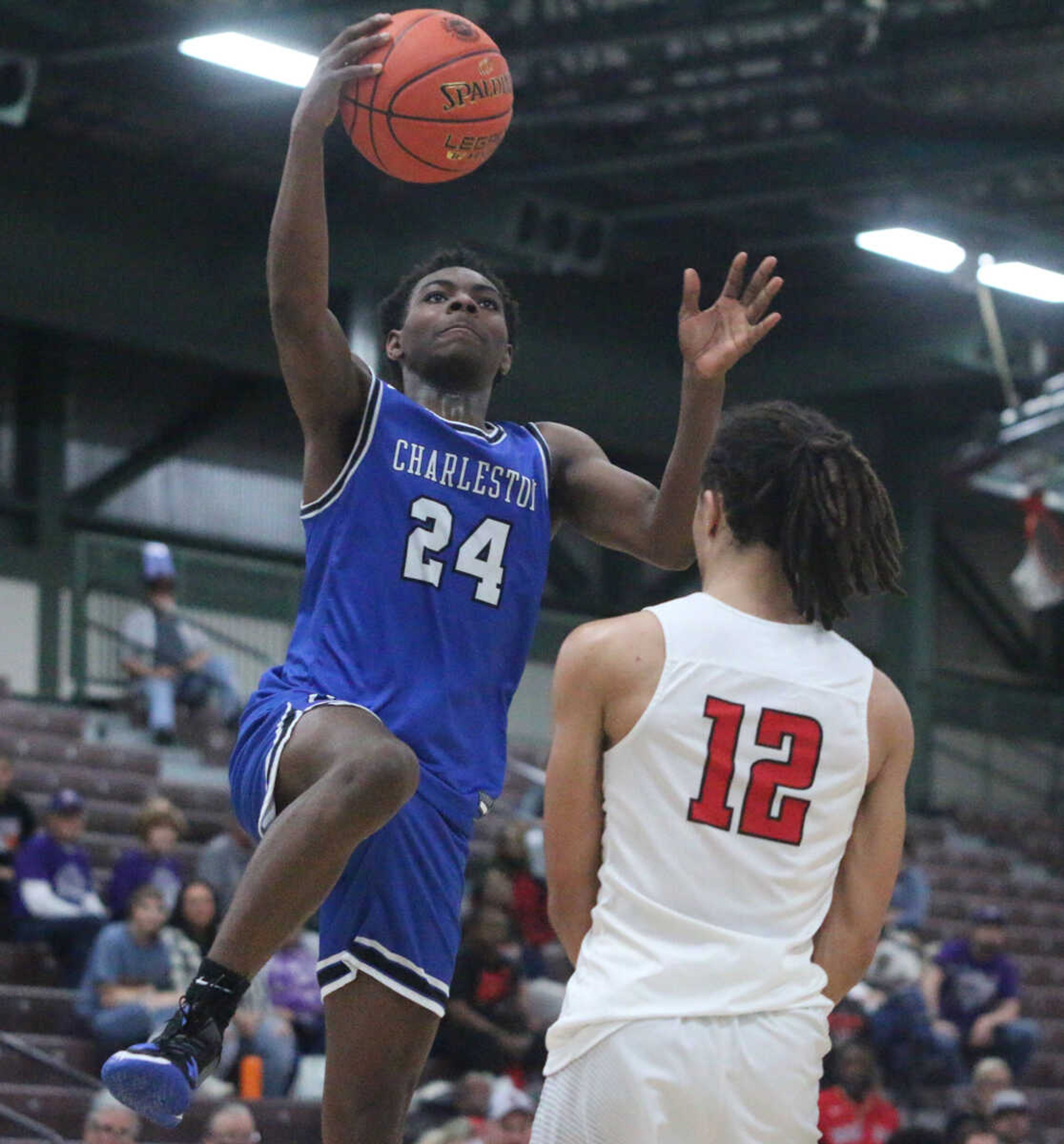 PJ Farmer elevates over a defender during Charleston's 74-61 win over Bishop DuBourg in a Class 3 quarterfinal at the Farmington Community Civic Center on Saturday, March 5. (Dennis Marshall/Standard-Democrat)