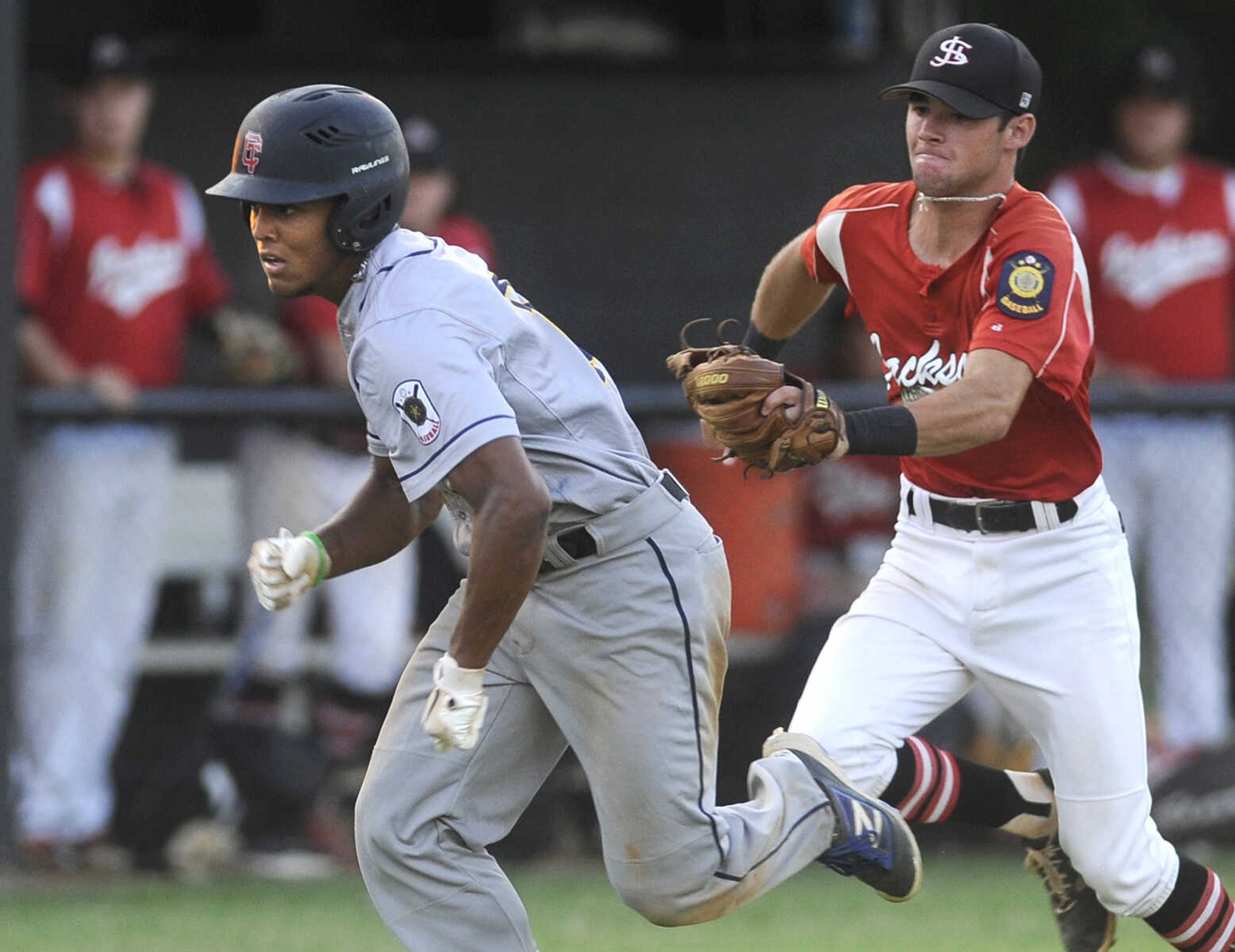 FRED LYNCH ~ flynch@semissourian.com
Cape Girardeau Post 63's Joseph Baker is caught in a rundown by Jackson Post 158 shortstop Landon Hahn during the second inning of a semifinal in the Senior Legion District Tournament Friday, July 13, 2018 in Sikeston, Missouri.