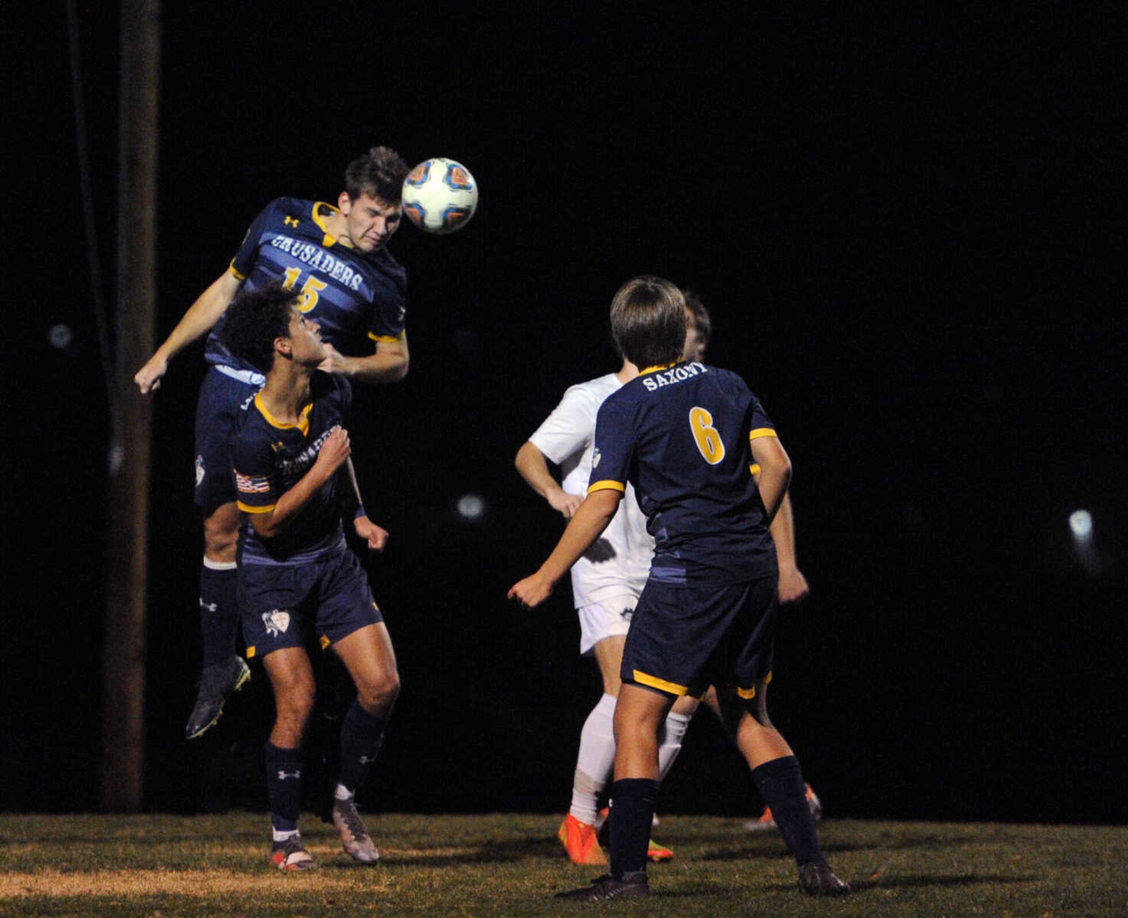 Saxony Lutheran's Noah Smith heads the ball against Perryville in a Class 2 District 1 matchup Tuesday at The Bank of Missouri Soccer Complex in Perryville.