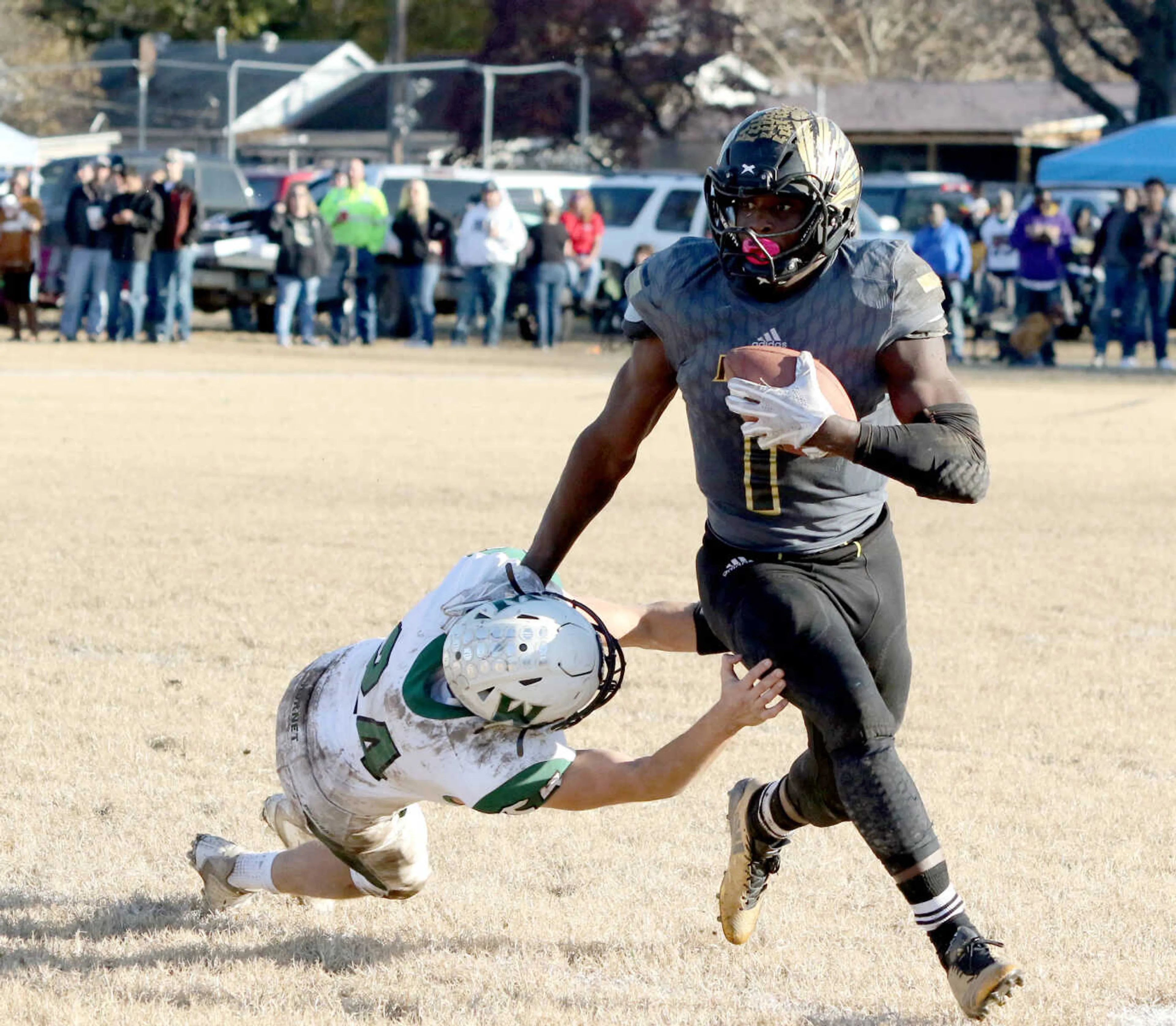 Hayti's Ivory Winters sheds the tackle attempt of Westran's Kolby Dale in a Class 1 semifinal game on Saturday, Nov. 24, 2018, in Hayti.