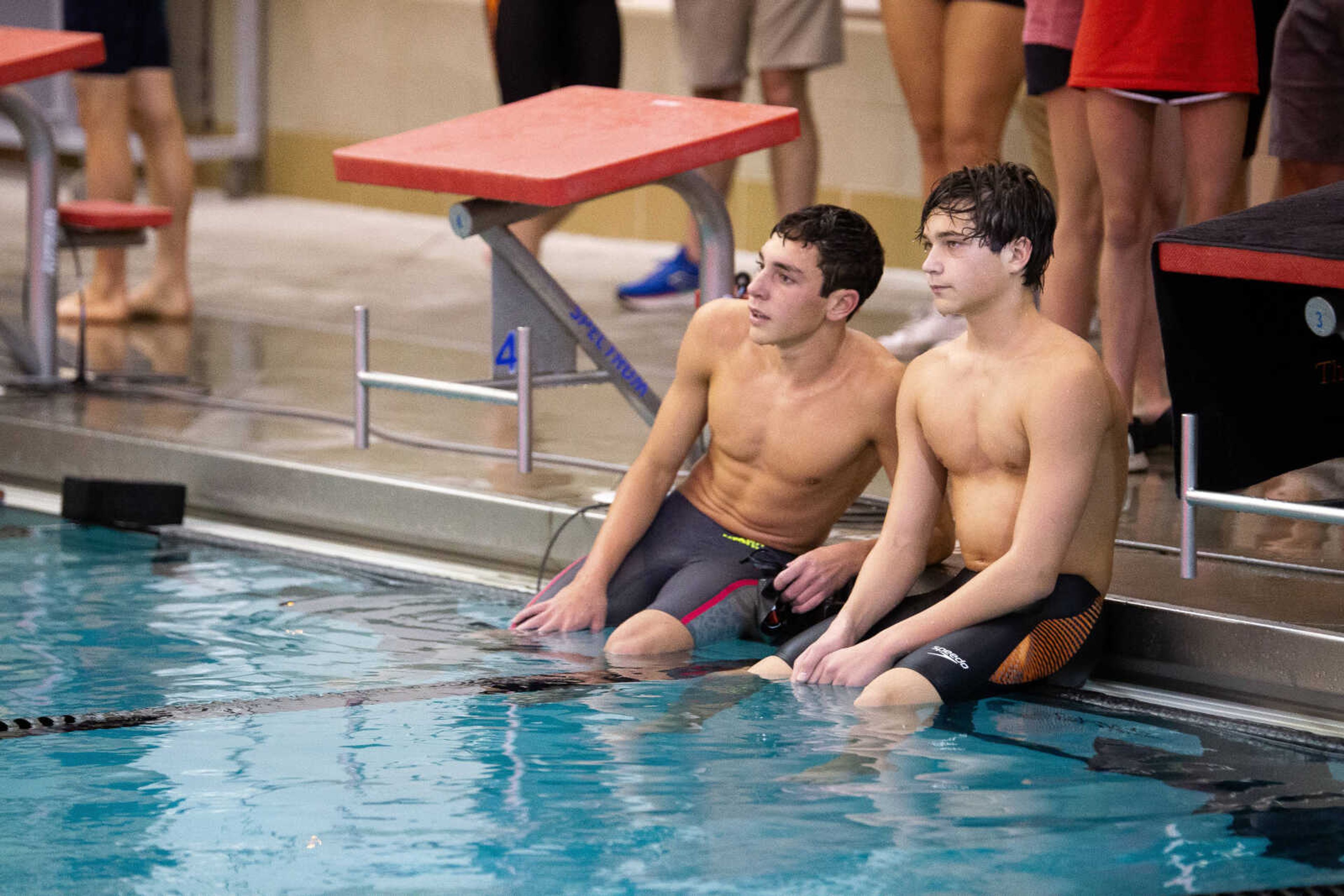 Jackson's Wade Lavalle, left, and Cape Central's Phineas Theall watch the time clock after finishing a race during the SEMO Conference swim meet on Tuesday at the Southeast Missouri State University Student Aquatic Center in Cape Girardeau.