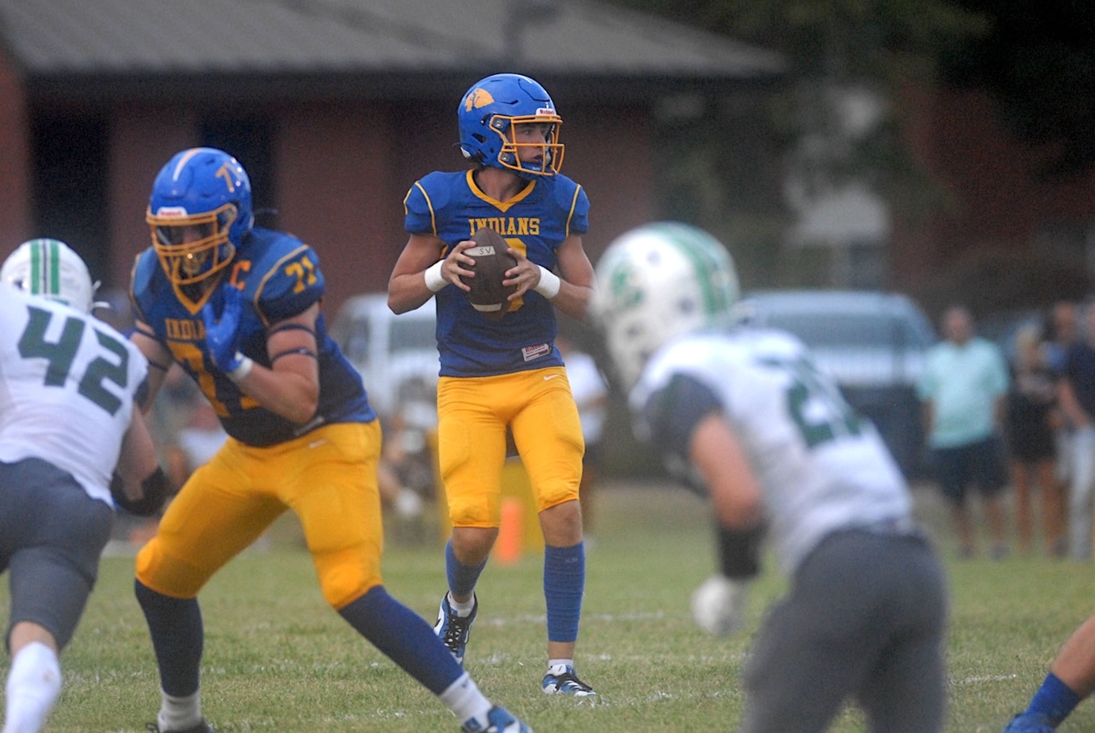 St. Vincent quarterback Nick Buchheit drops back to pass against Ste. Genevieve on Friday, August 30, in Perryville, Mo.
