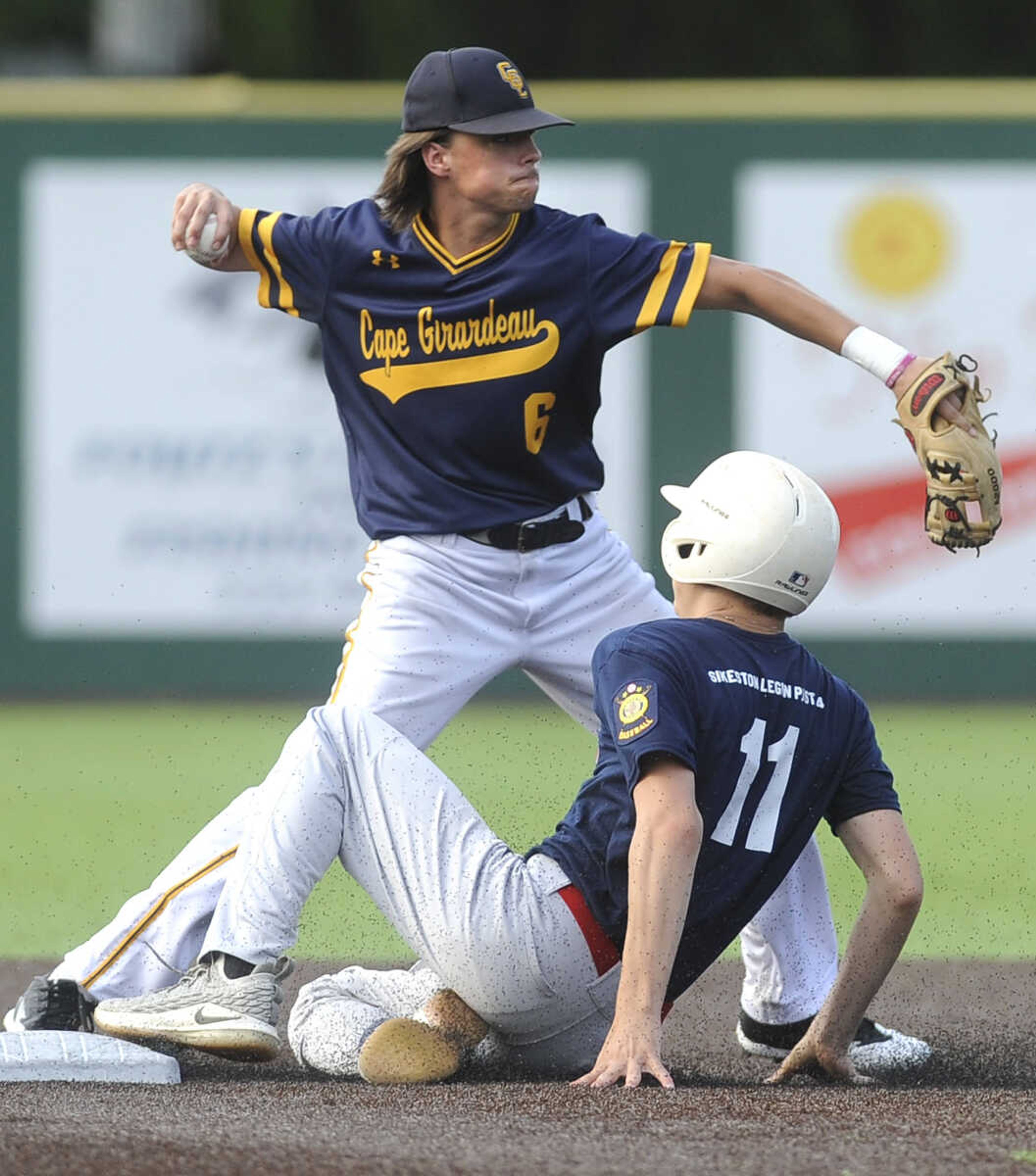 FRED LYNCH ~ flynch@semissourian.com
Cape Girardeau Post 63 shortstop Luke Marcum throws to first base after Sikeston's Trace Wheetley was forced out during the second inning of the first game Wednesday, June 20, 2018 at Capaha Field.