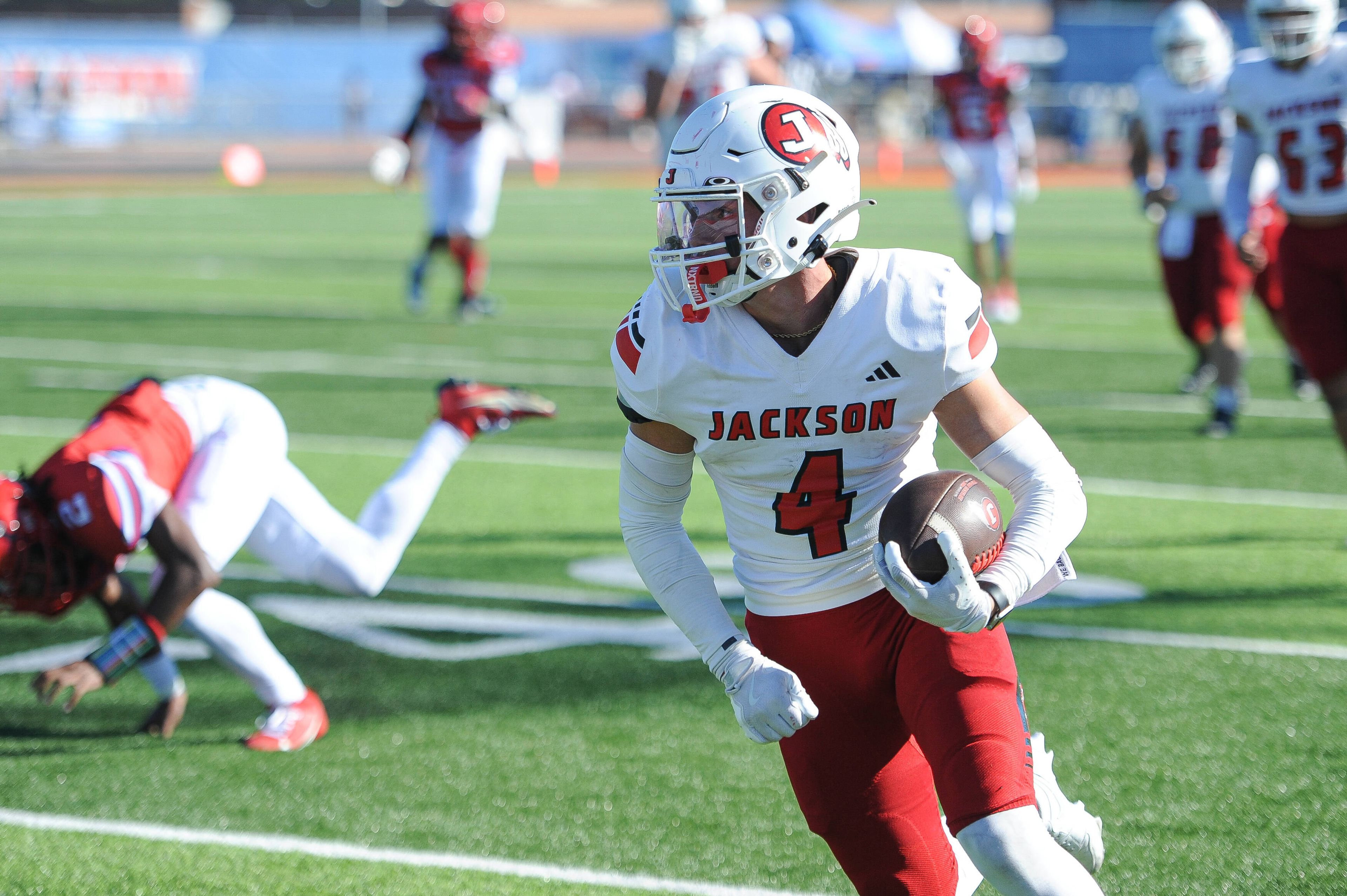 Jackson's Kai Crowe breaks upfield during a Saturday, September 7, 2024 game between the Jackson Indians and the Cahokia Comanches at East St. Louis Senior High School in East St. Louis, Ill. Jackson defeated Cahokia, 49-26. 