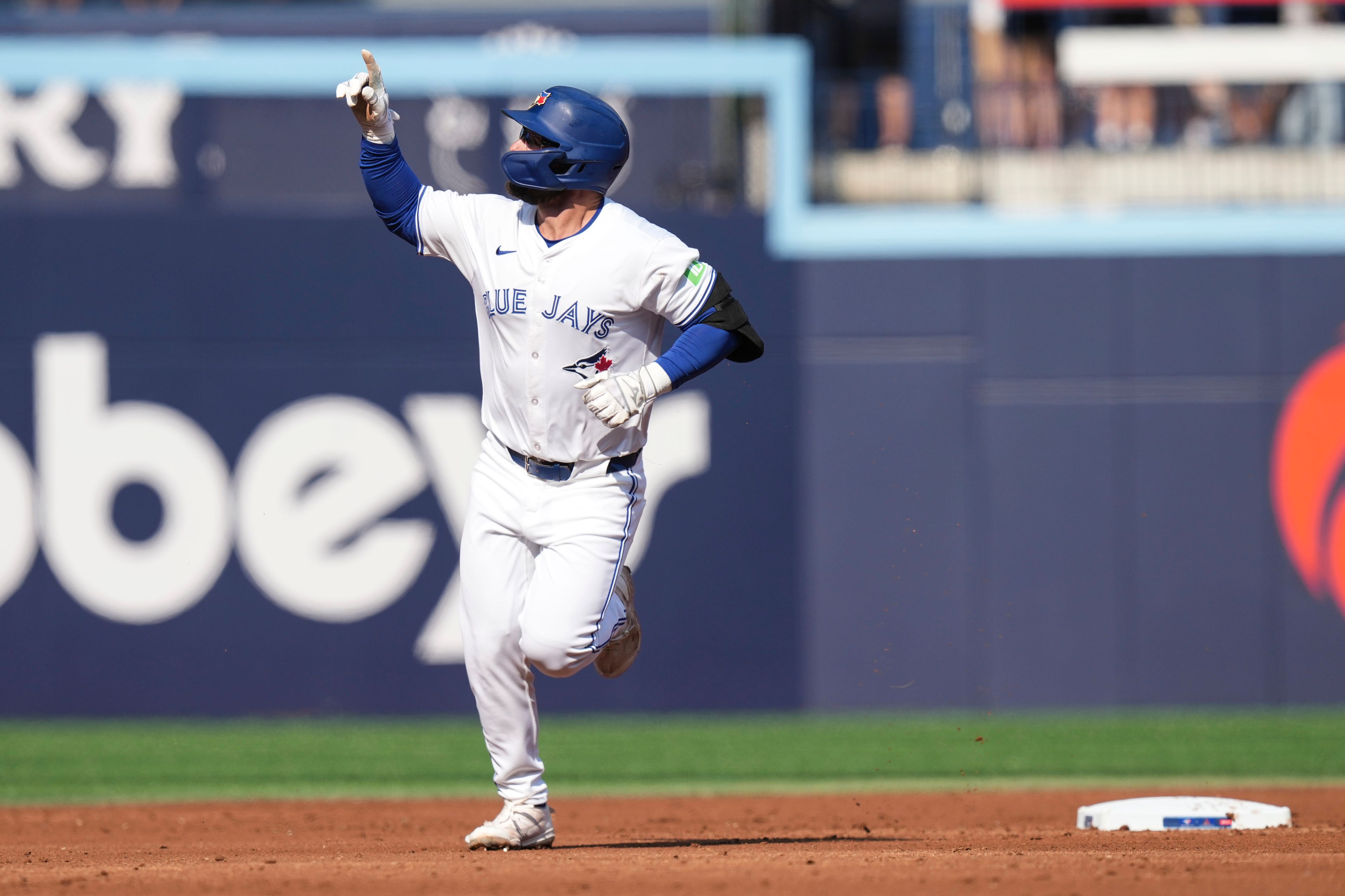 Toronto Blue Jays' Davis Schneider rounds the bases after hitting a home run off St. Louis Cardinals pitcher Kyle Gibson during third inning interleague MLB baseball action in Toronto, Saturday Sept. 14, 2024. (Chris Young/The Canadian Press via AP)