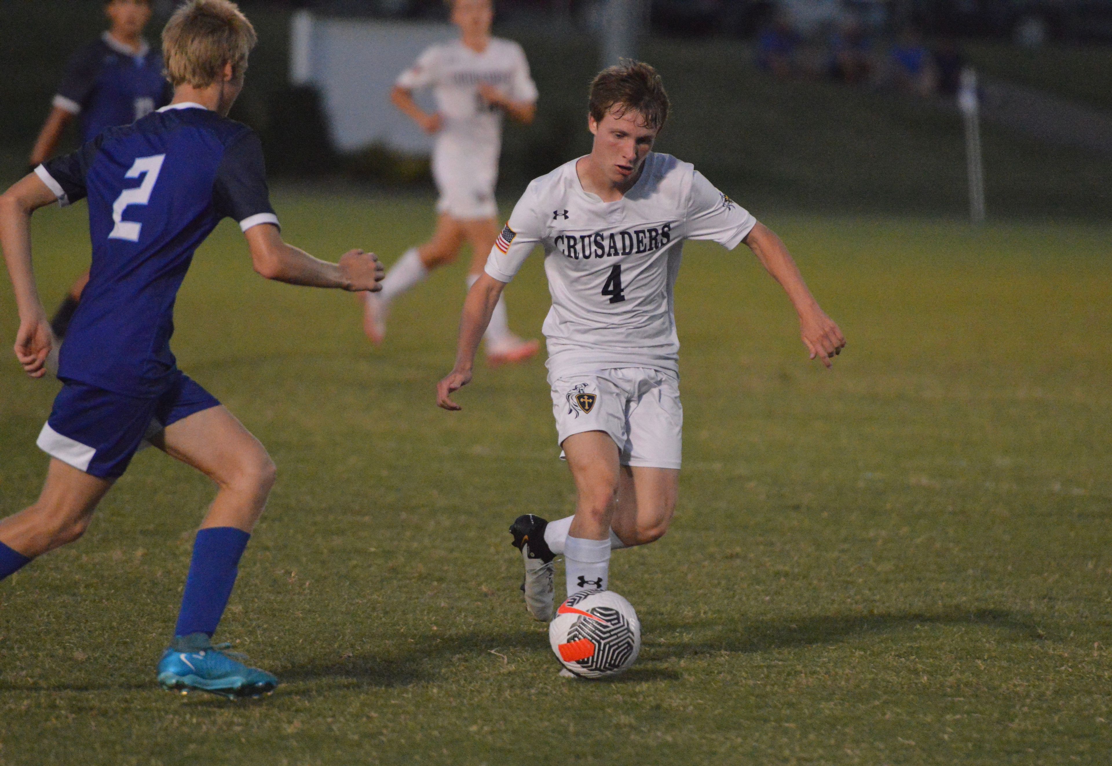 Saxony Lutheran senior Jonathan Pfeiffer scrambles the ball past a Notre Dame defender in the second half of a game on Tuesday, Sept. 17.