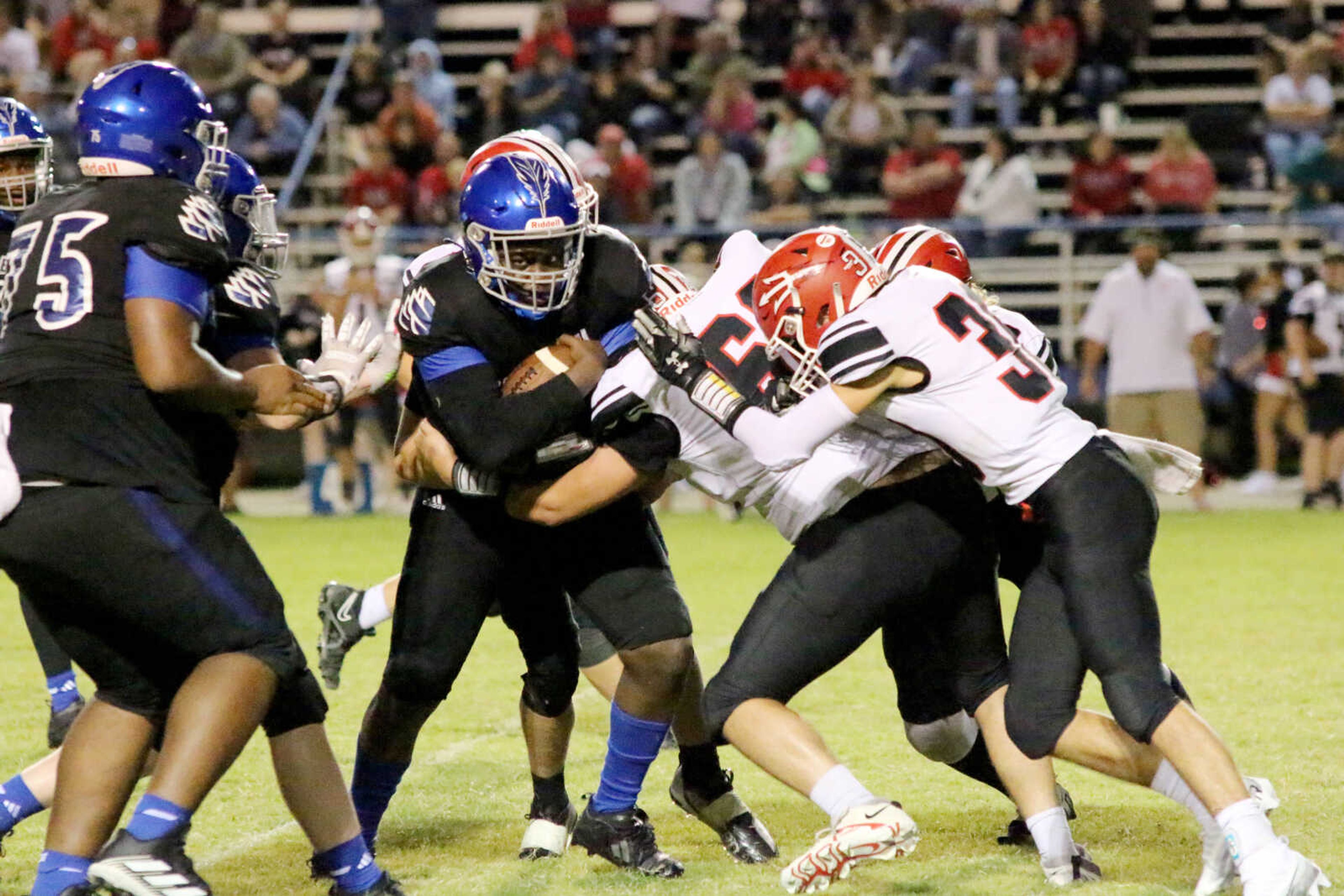 Charleston's Ko'Terrion Owens (9) powers ahead for a gain during a 14-12 loss to Chaffee at John Harris Marshall Stadium on Thursday, August 31, 2023.&nbsp;