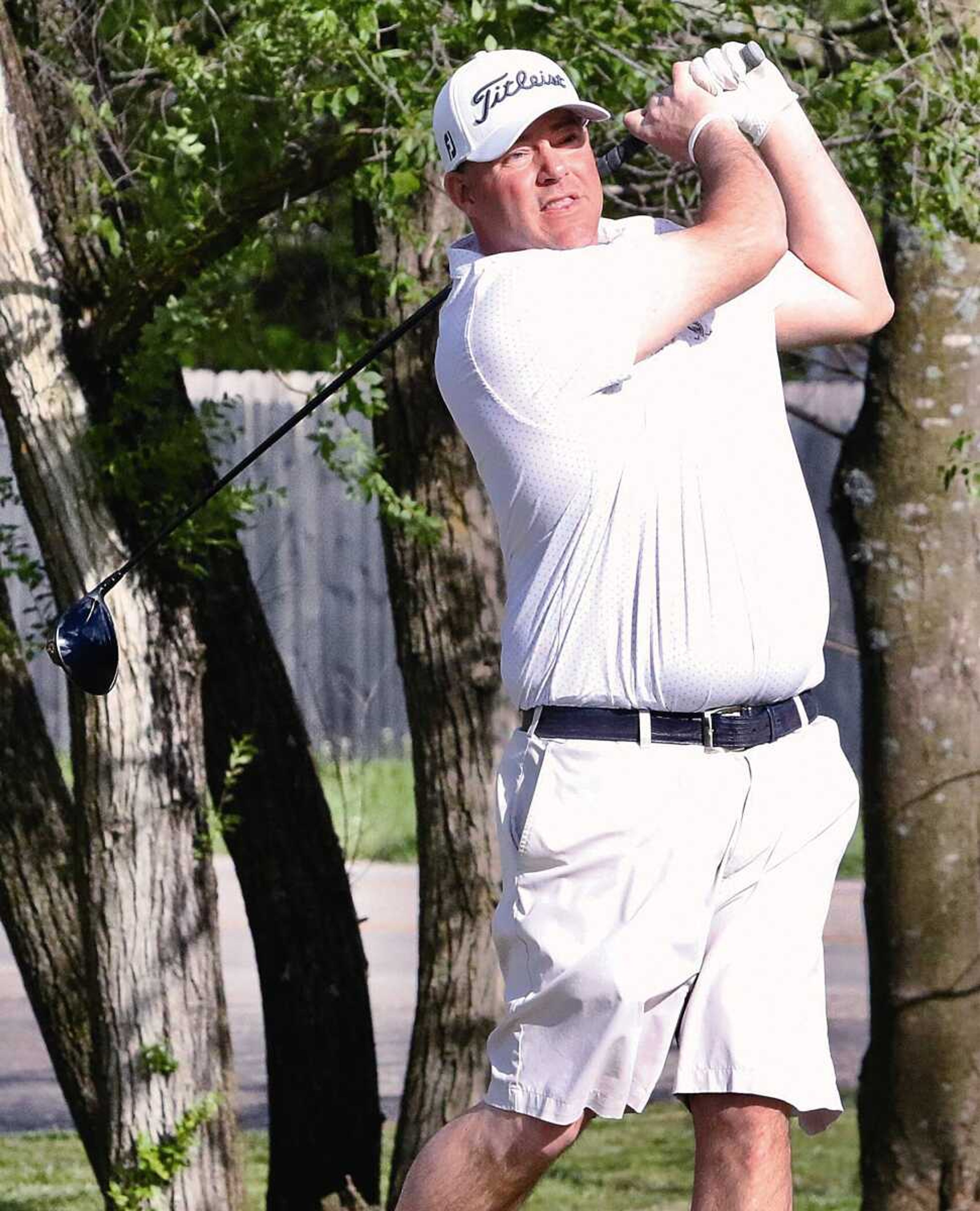 Chad Niezing watches the ball after his swing during the Ozark Shootout Friday at Westwood Hills Country Club. Niezing, the defending Tom Hoover Ozark Invitational champion, also won Friday’s shootout.