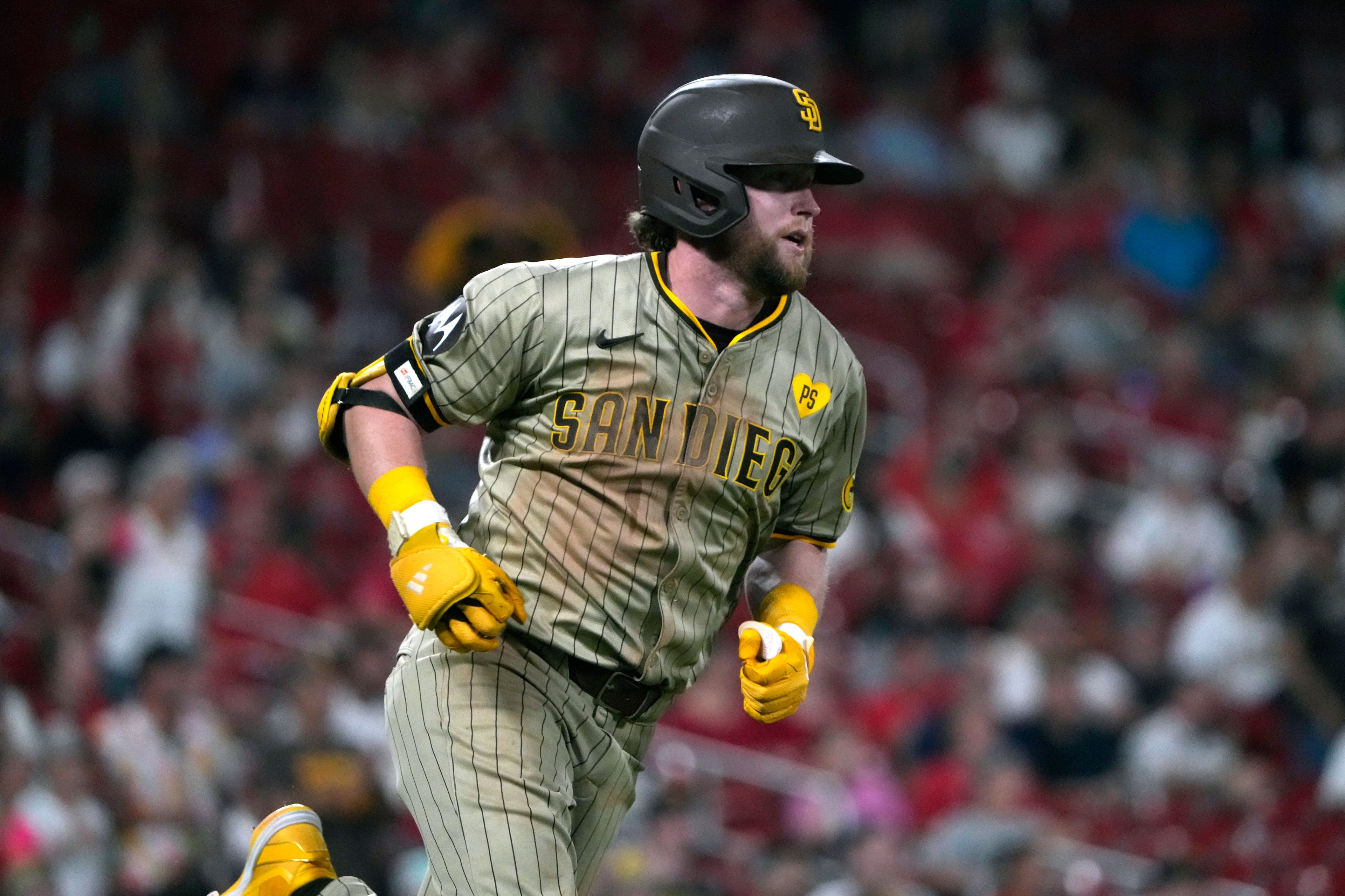 San Diego Padres' Jake Cronenworth heads to first on an RBI single during the seventh inning of a baseball game against the St. Louis Cardinals Tuesday, Aug. 27, 2024, in St. Louis. (AP Photo/Jeff Roberson)