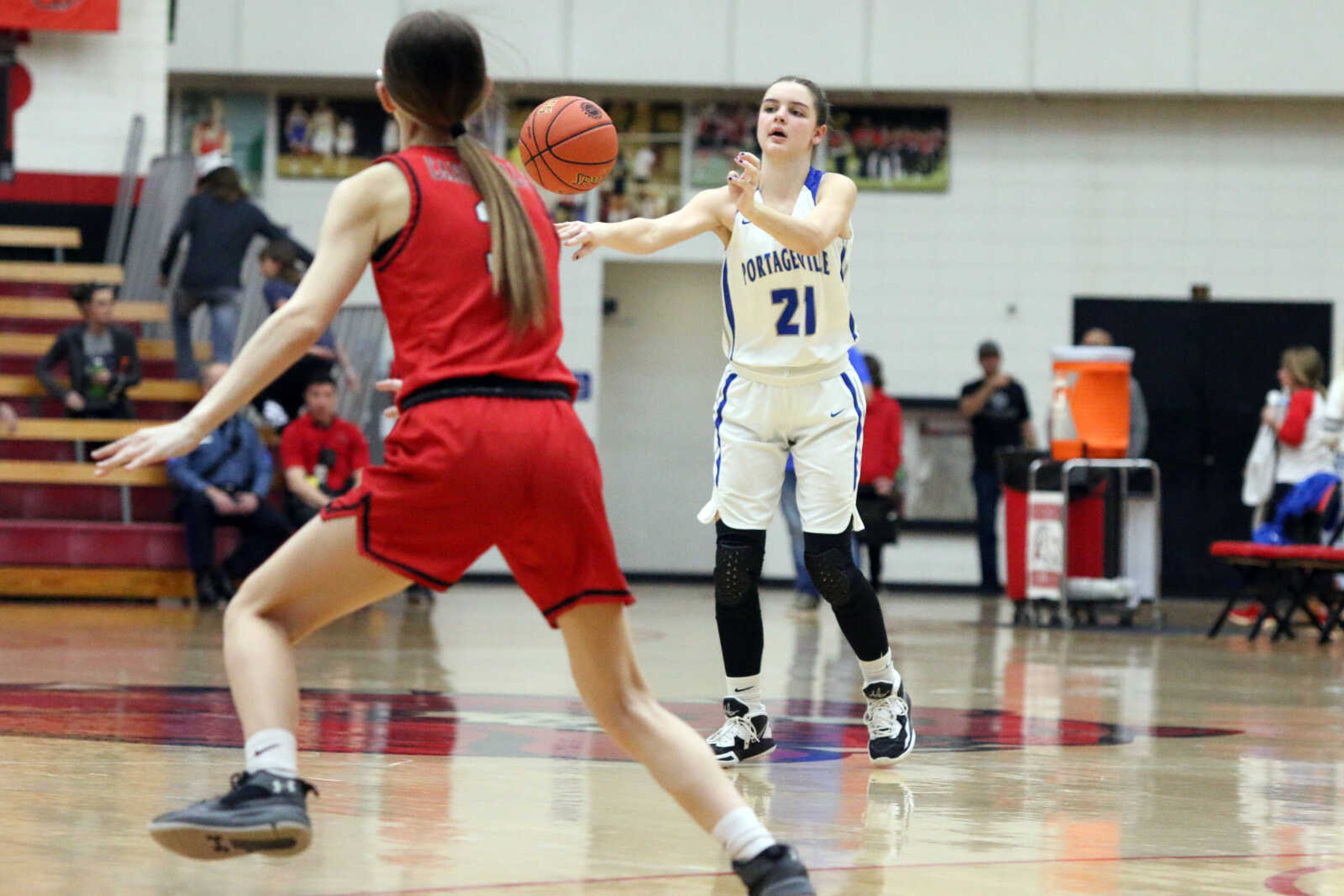 Portageville's Aubrey Greenwell (21) passes&nbsp;during a 61-25 win over Woodland in a MSHSAA Class 3 Sectional at the Sikeston Fieldhouse on Monday, Feb. 28. (Dennis Marshall/Standard-Democrat)