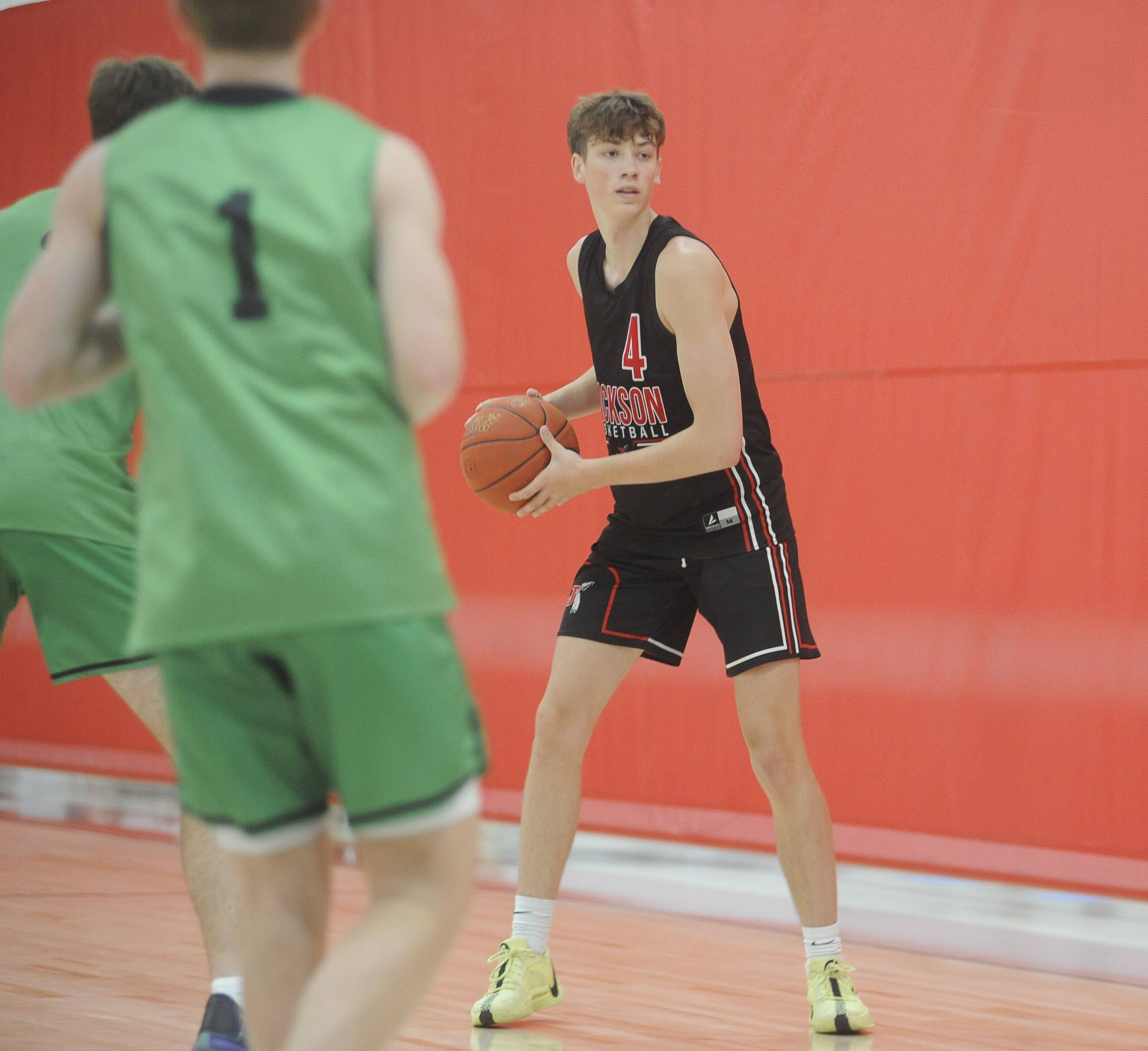 Jackson High School senior forward Kole Deck looks to pass to a teammate earlier this summer during a game at the Rib City Shootout at the Bearcat Event Center in Dexter, Mo.