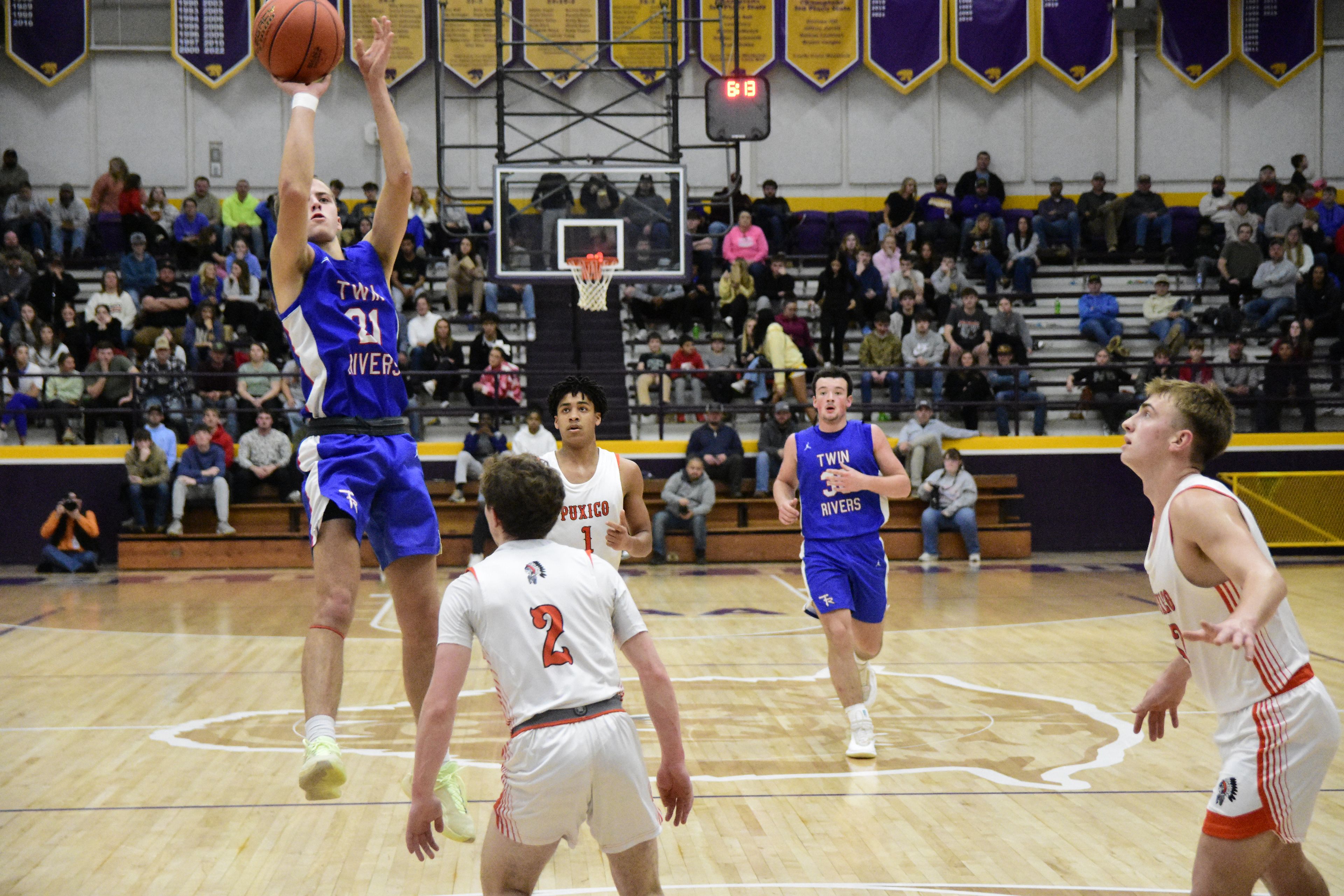 Twin Rivers’ Axl Wilkerson launches a three-point attempt in the first half of their semifinal game against Puxico at the Bloomfield Christmas Tournament on Monday, December 29, 2025.
