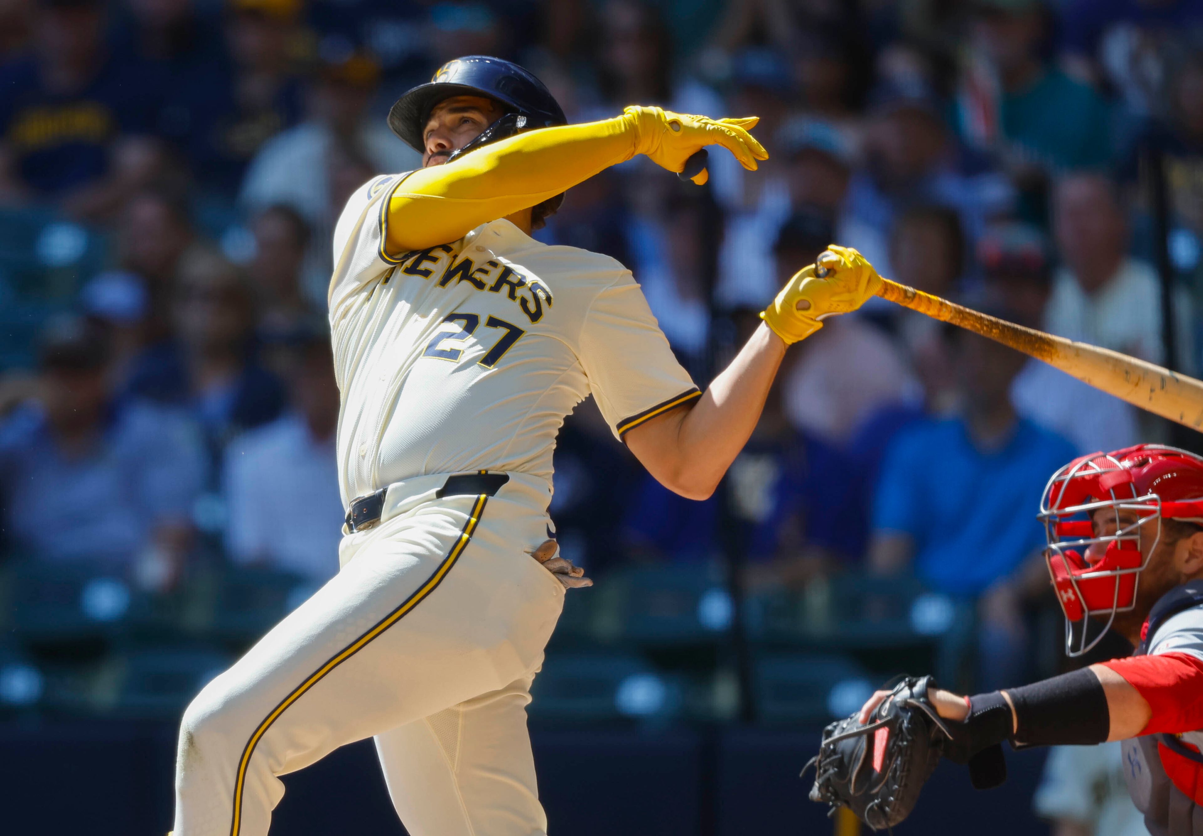 Milwaukee Brewers Willy Adames (27) watches his three-run home run during the first inning of a baseball game against the St. Louis Cardinals Monday, Sept. 2, 2024, in Milwaukee. (AP Photo/Jeffrey Phelps)