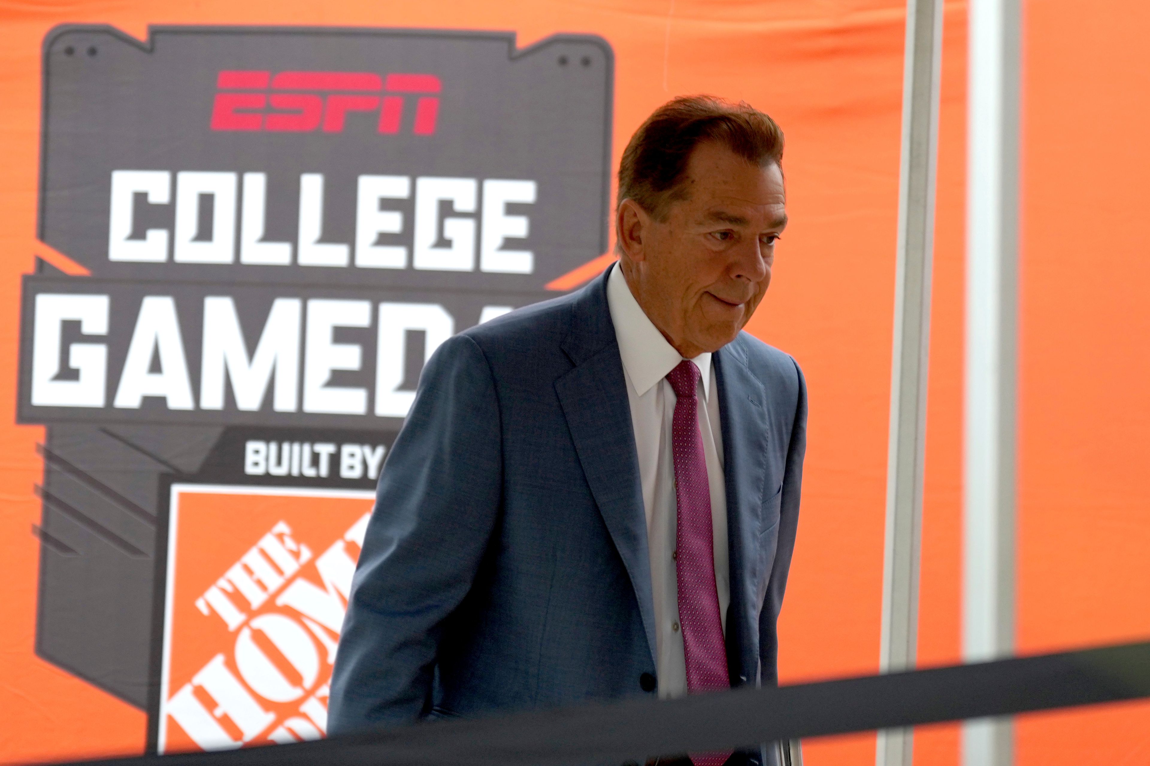 ESPN football analyst Nick Saban walks to the stage of College Game Day outside of Kyle Field on Saturday, Aug. 31, 2024, in College Station, Texas. (AP Photo/Sam Craft)