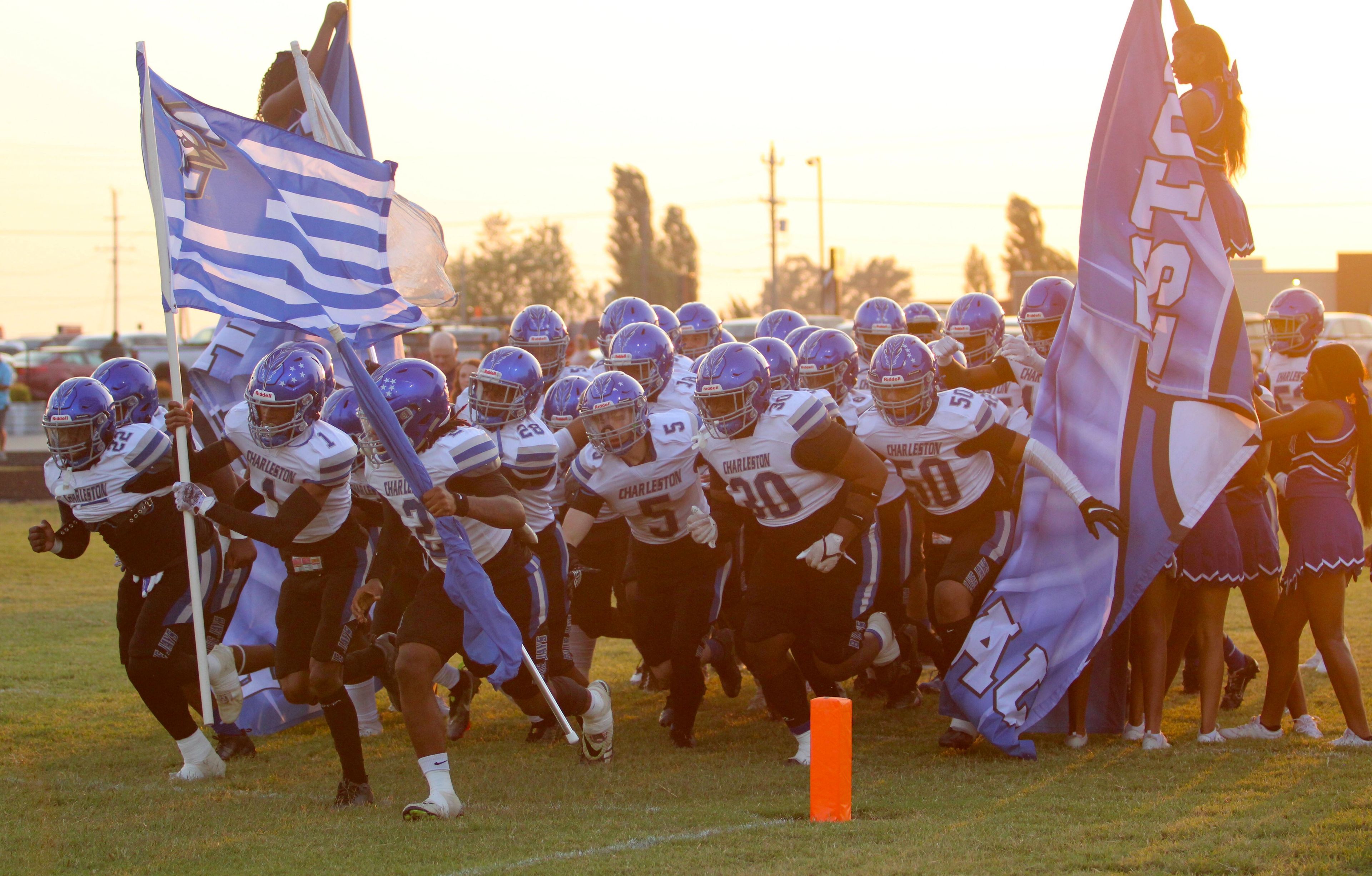 Charleston runs through the banner before the Friday, September 6, 2024 game between the Charleston Blue Jays and the Chaffee Red Devils at Chaffee High School in Chaffee, Mo. Charleston defeated Chaffee 38-0. 