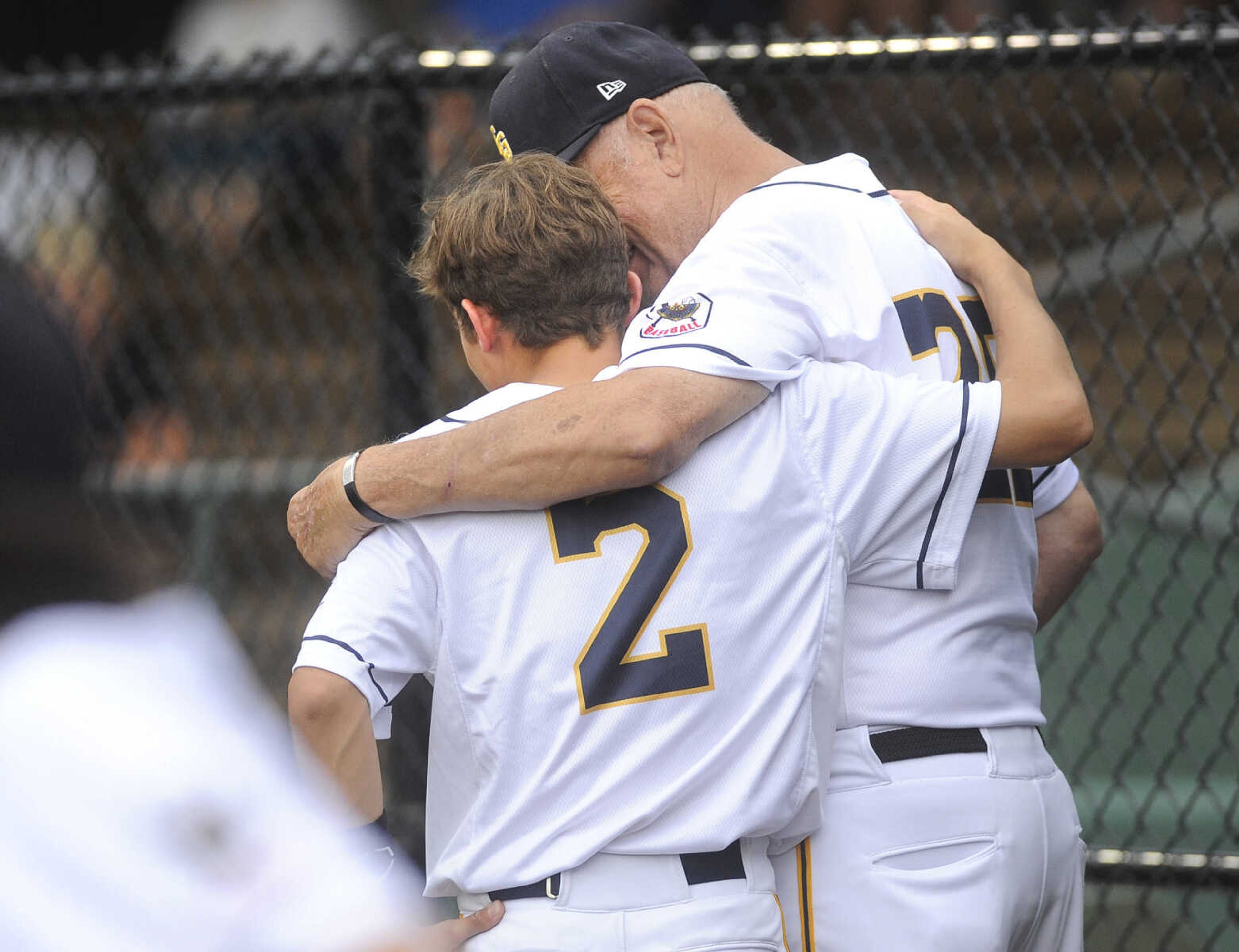 FRED LYNCH ~ flynch@semissourian.com
Cape Girardeau Post 63 Senior Legion assistant coach Bill Bohnert talks to Brendan Wilkens in the dugout during the game with Pemiscot County on Tuesday, June 12, 2018 at Capaha Field.