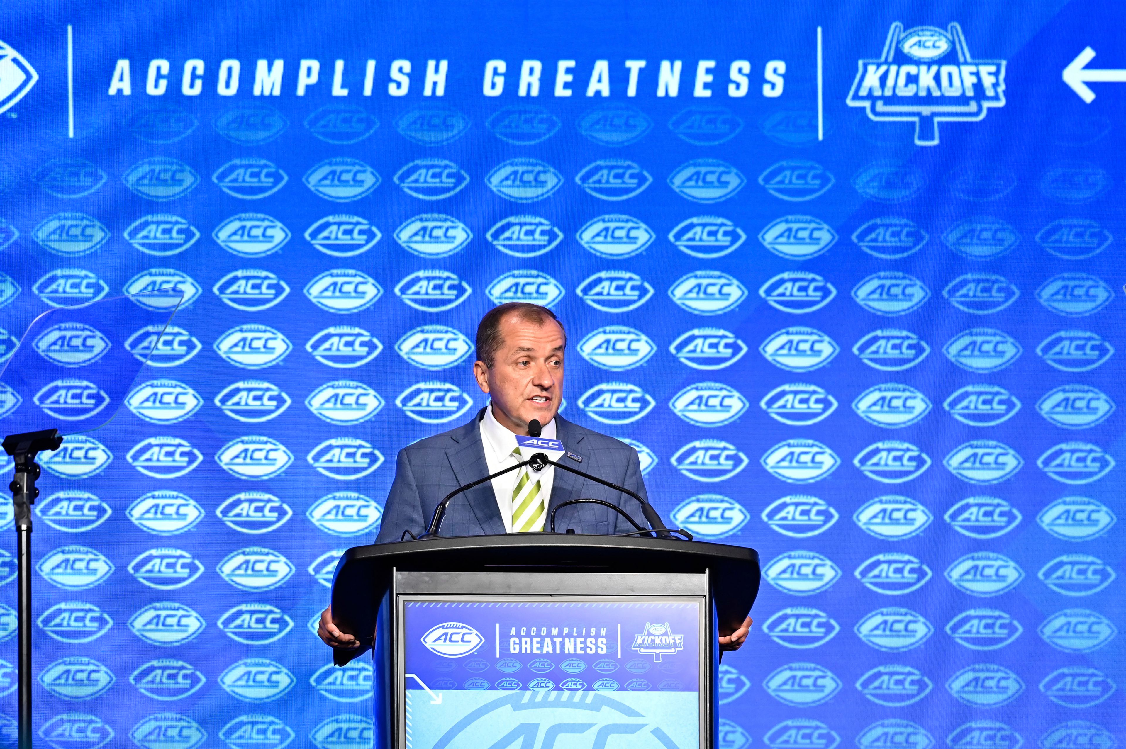 FILE - Atlantic Coast Conference commissioner Jim Phillips speaks during an NCAA college football news conference at the ACC media days, Monday, July 22, 2024, in Charlotte, N.C. (AP Photo/Matt Kelley, File)