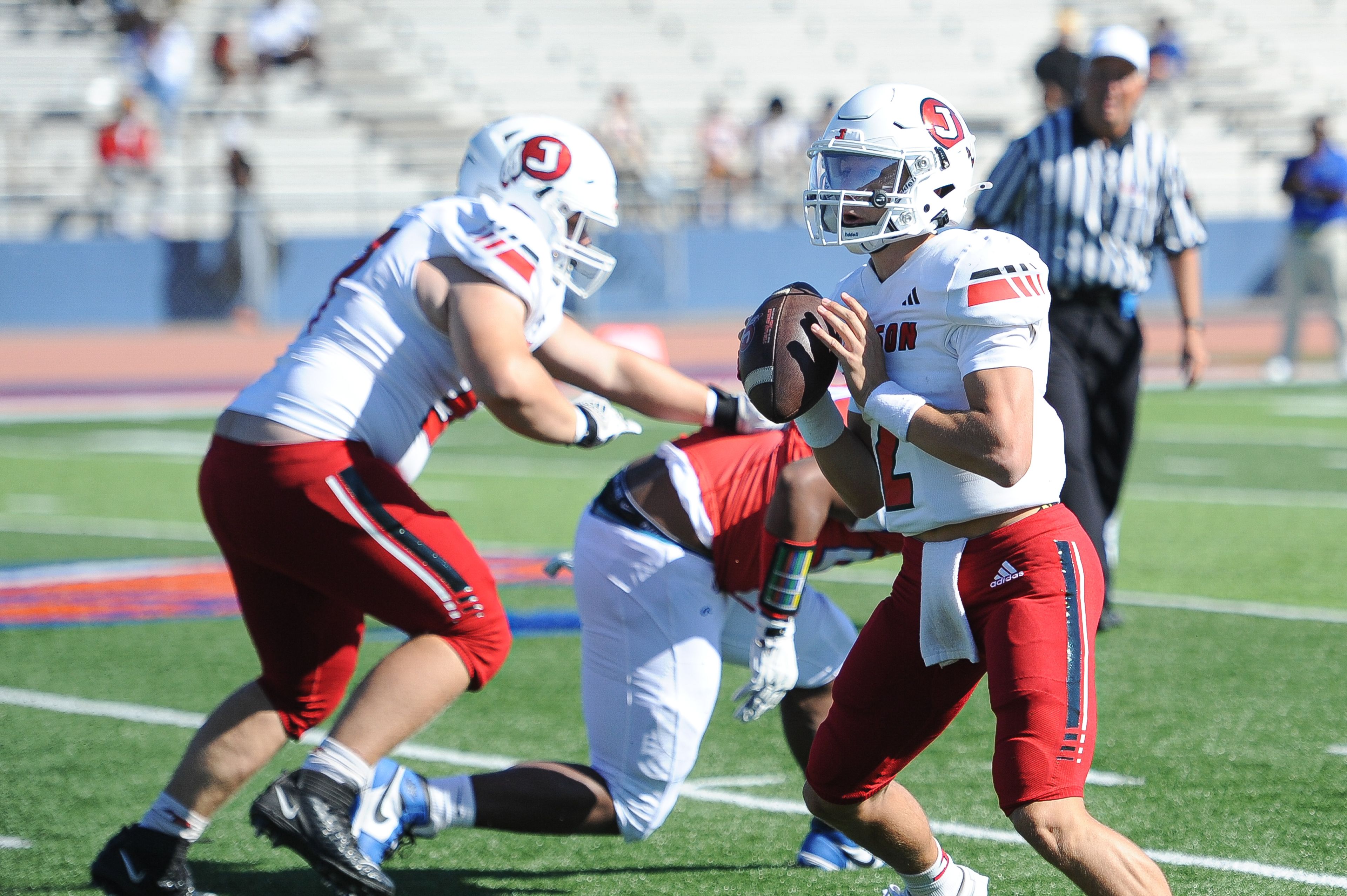 Jackson's Drew Parsons surveys upfield during a Saturday, September 7, 2024 game between the Jackson Indians and the Cahokia Comanches at East St. Louis Senior High School in East St. Louis, Ill. Jackson defeated Cahokia, 49-26.