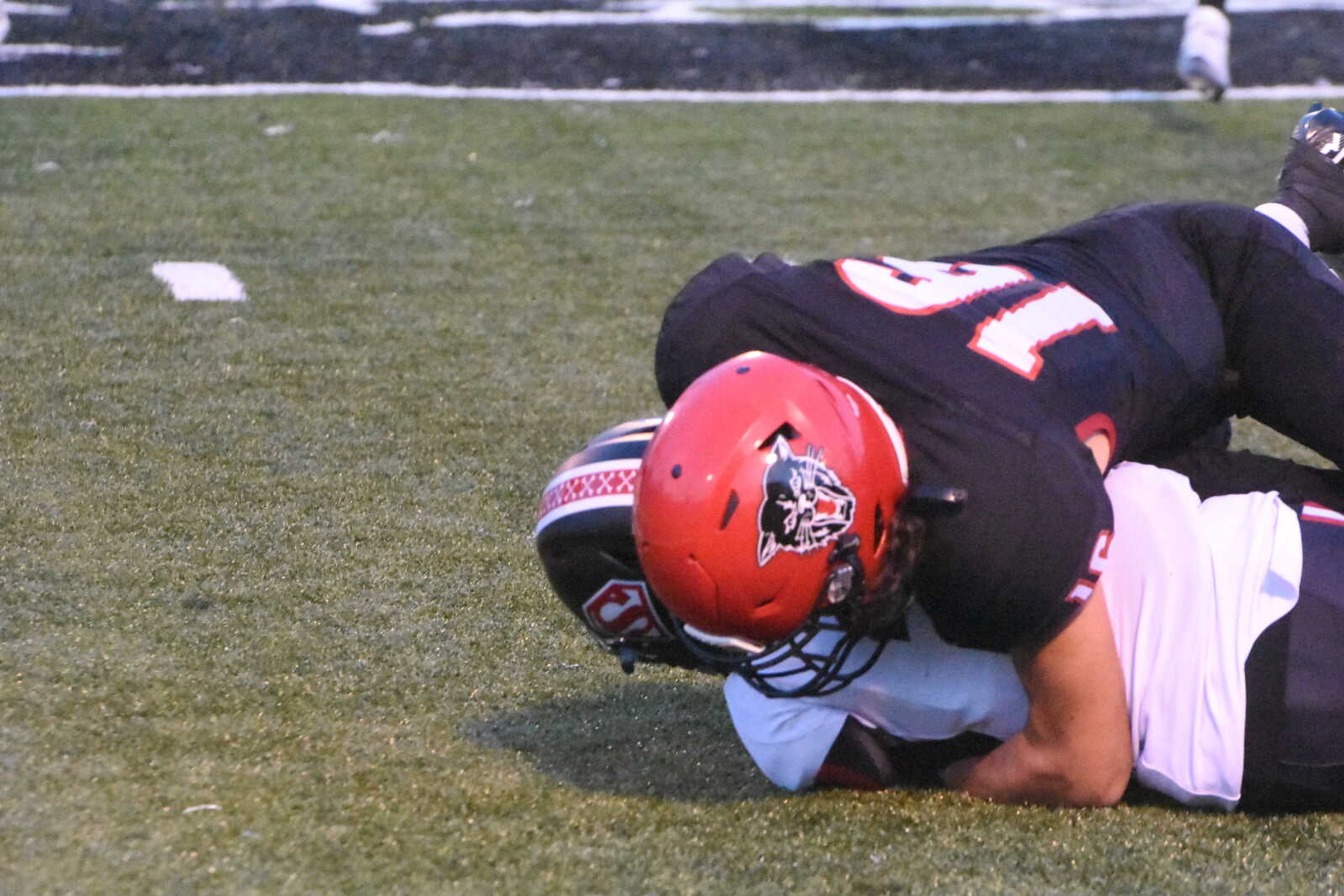 Dexter's Juan Cueves (16) tackles a Sikeston ball carrier.