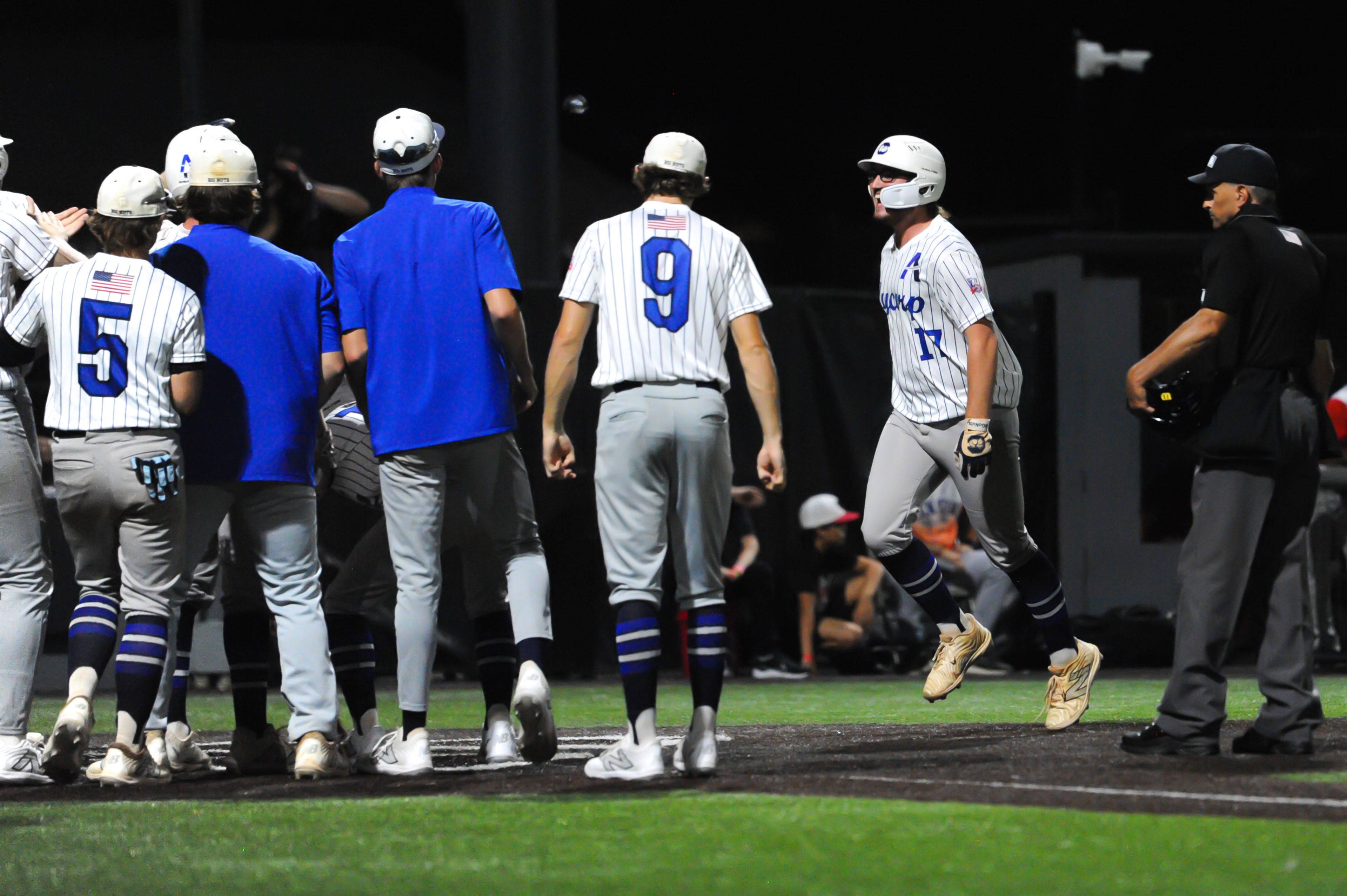 Aycorp teammates meet Brady Swims after he hit a homer during a Tuesday, August 13, 2024 Babe Ruth World Series game between the Aycorp Fighting Squirrels and Holland Henson of the Netherlands at Capaha Field in Cape Girardeau, Mo. Aycorp defeated the Netherlands, 12-2 in five innings.