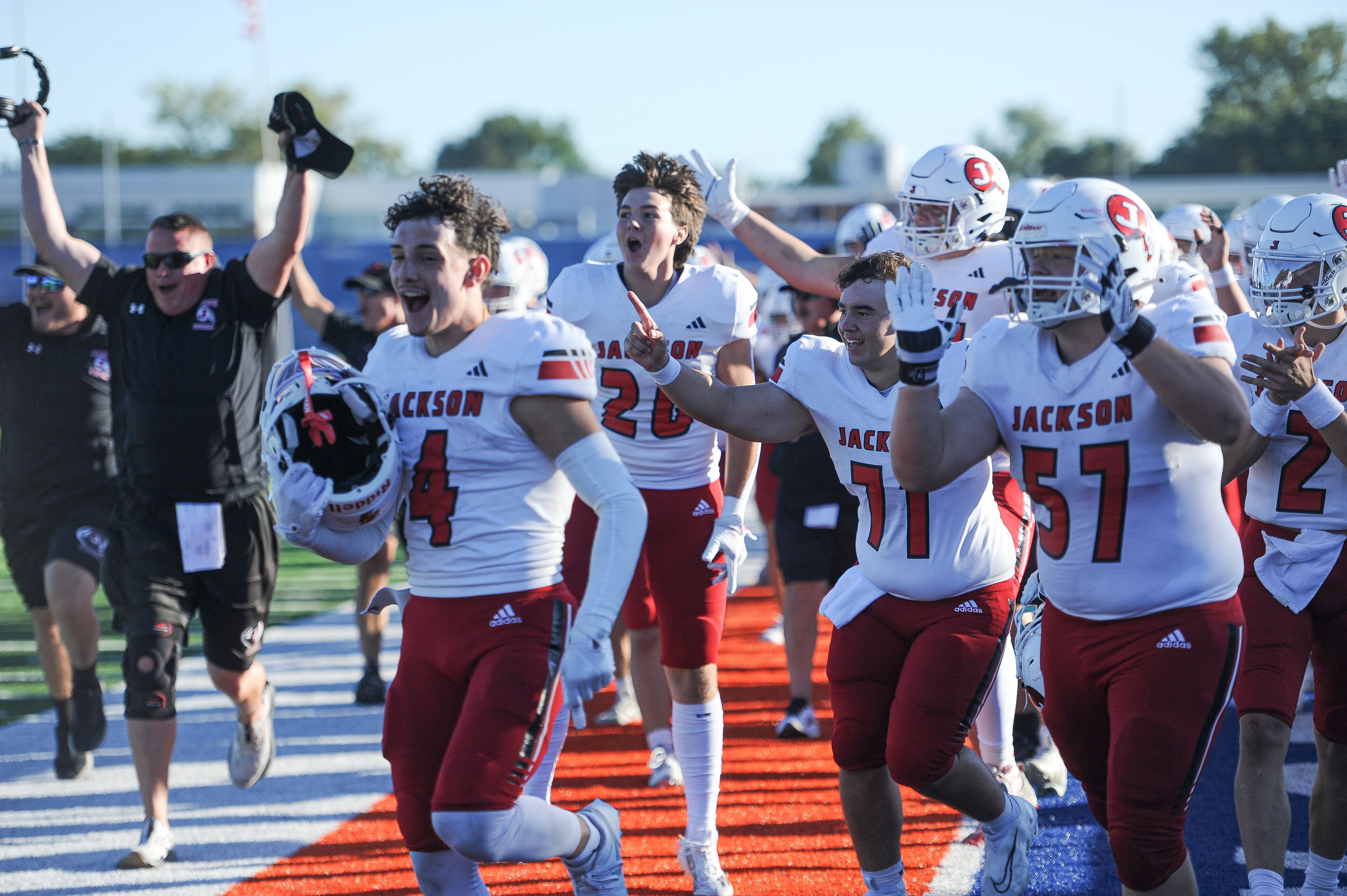 The Jackson sideline celebrates a fumble return touchdown during a Saturday, September 7, 2024 game between the Jackson Indians and the Cahokia Comanches at East St. Louis Senior High School in East St. Louis, Ill. Jackson defeated Cahokia, 49-26.