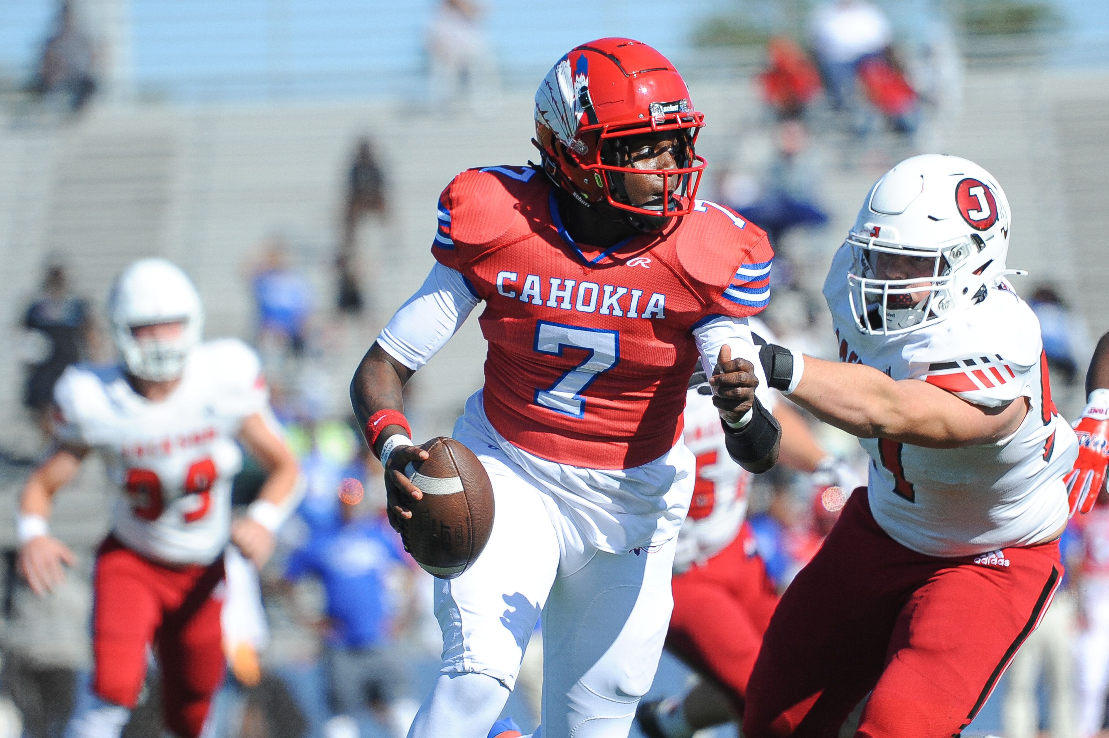 Cahokia's Zion Taylor rolls right during a Saturday, September 7, 2024 game between the Jackson Indians and the Cahokia Comanches at East St. Louis Senior High School in East St. Louis, Ill. Jackson defeated Cahokia, 49-26.