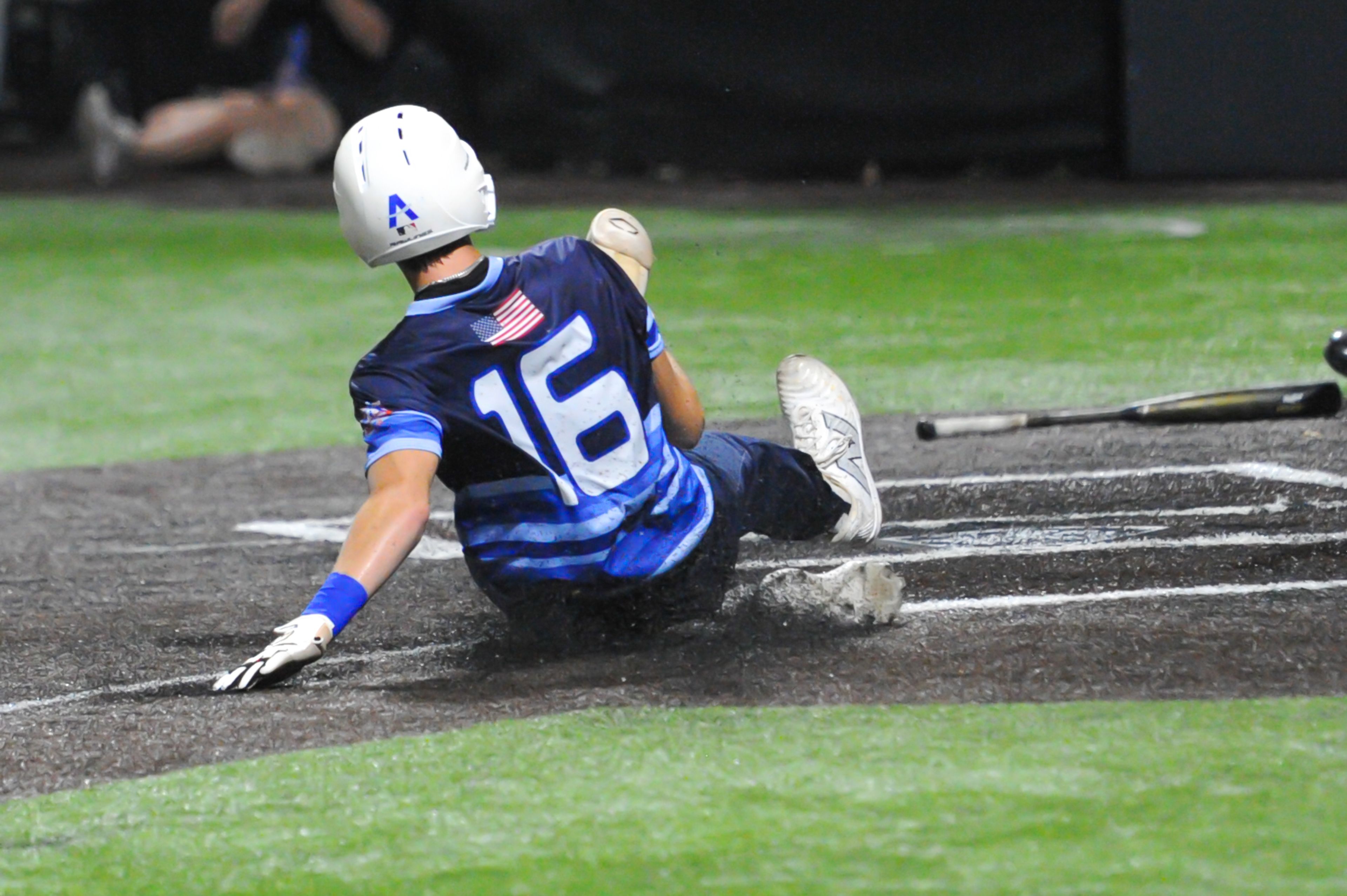 Aycorp's Brady Smith slides safely into home plate during an August 14, 2024 Babe Ruth World Series game between the Aycorp Fighting Squirrels and the Altoona, Pennsylvania, at Capaha Field in Cape Girardeau, Mo. Aycorp defeated Altoona, 12-11.