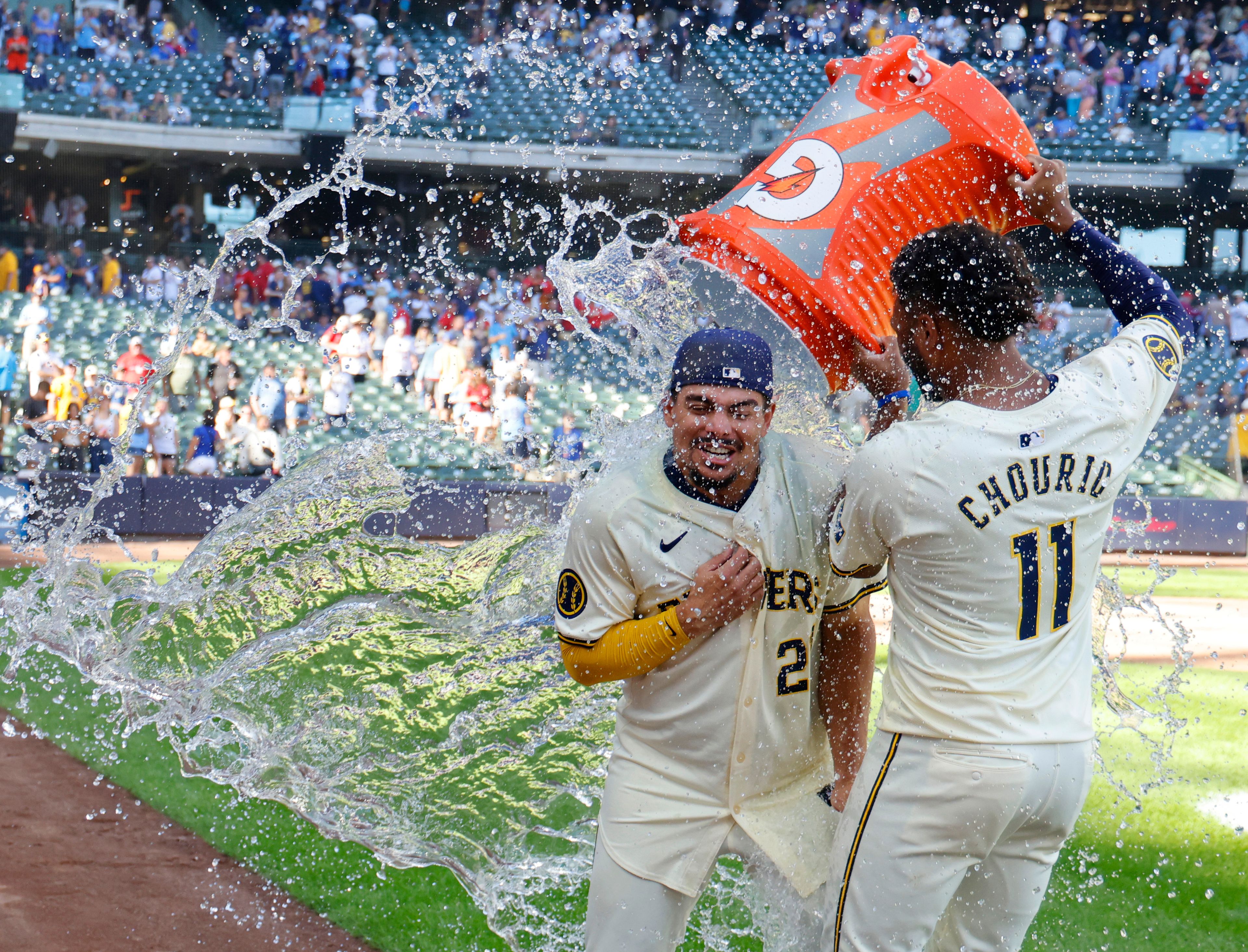 Milwaukee Brewers' Jackson Chourio (11) douses Willy Adames, left, after a baseball game against the St. Louis Cardinals, Monday, Sept. 2, 2024, in Milwaukee. (AP Photo/Jeffrey Phelps)