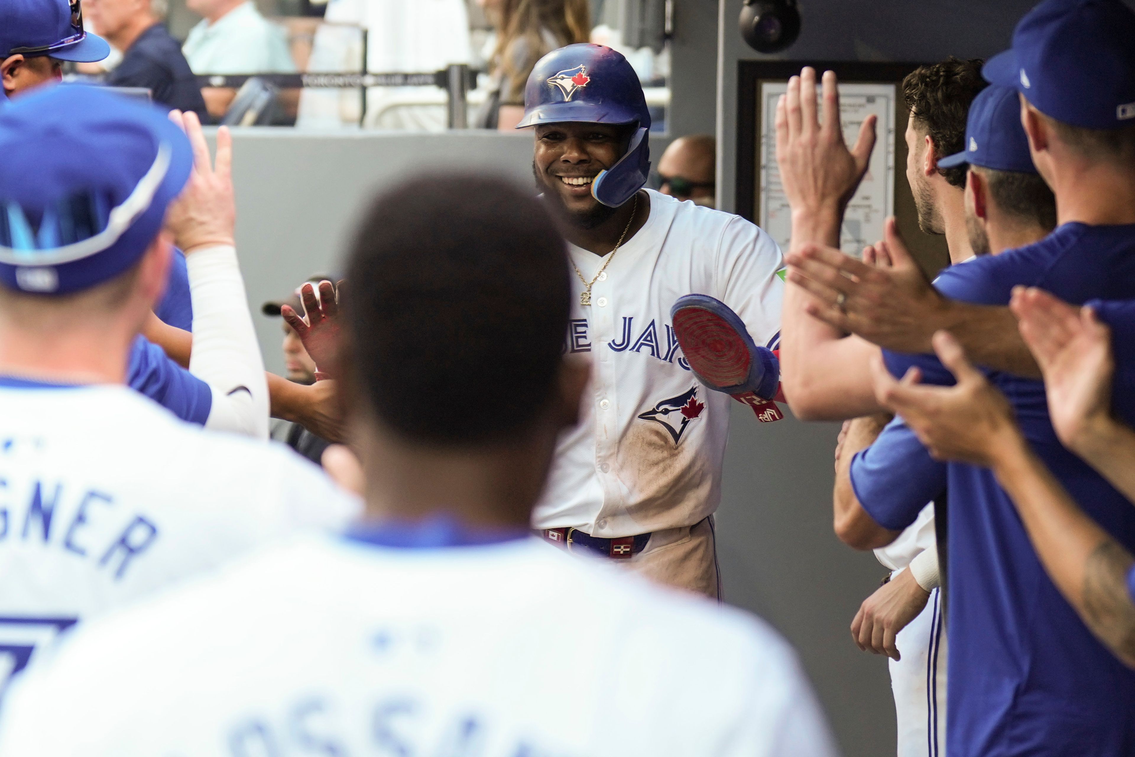 Toronto Blue Jays' Vladimir Guerrero Jr. celebrates in the dugout after scoring a run during seventh inning interleague MLB baseball action against the St. Louis Cardinals in Toronto, Saturday, September 14, 2024. (Chris Young/The Canadian Press via AP)