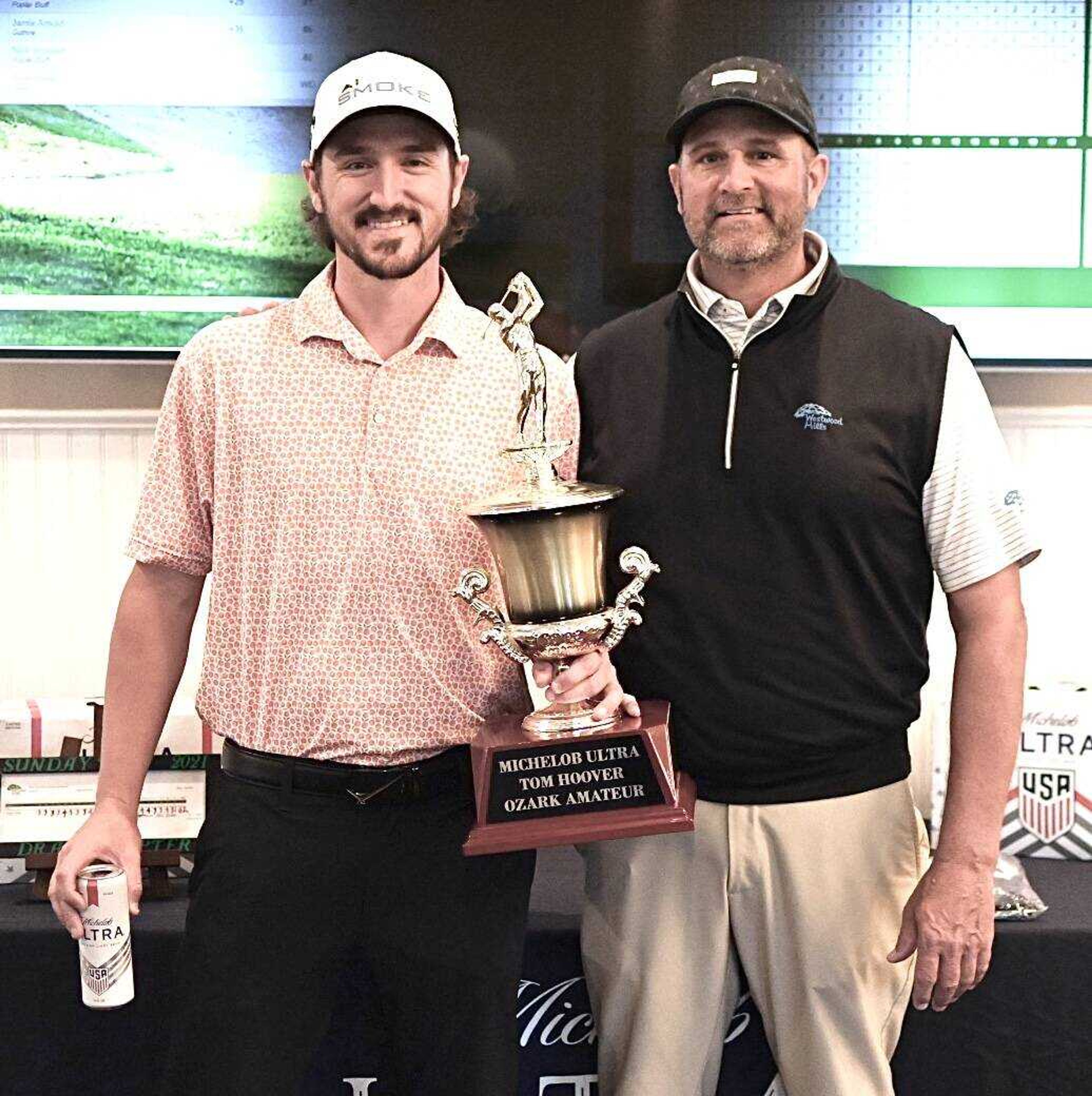 Drake Stepter (left) is presented with the 78th annual Tom Hoover Ozark Invitational championship trophy Sunday evening by Westwood Hills Country Club professional and tournament director Jimmy Vernon. Stepter won the tournament in a three-way, sudden-death playoff. 