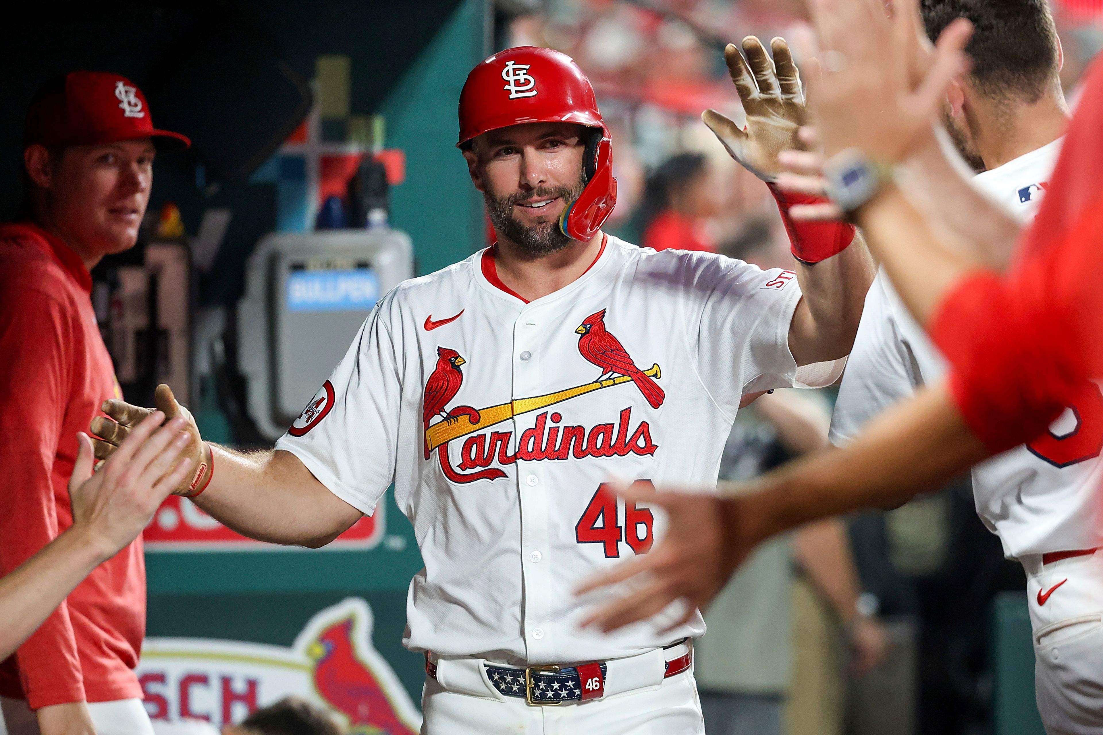 St. Louis Cardinals' Paul Goldschmidt, center, is congratulated by teammates after scoring during the fourth inning of a baseball game against the Pittsburgh Pirates, Thursday, Sept. 19, 2024, in St. Louis. (AP Photo/Scott Kane)