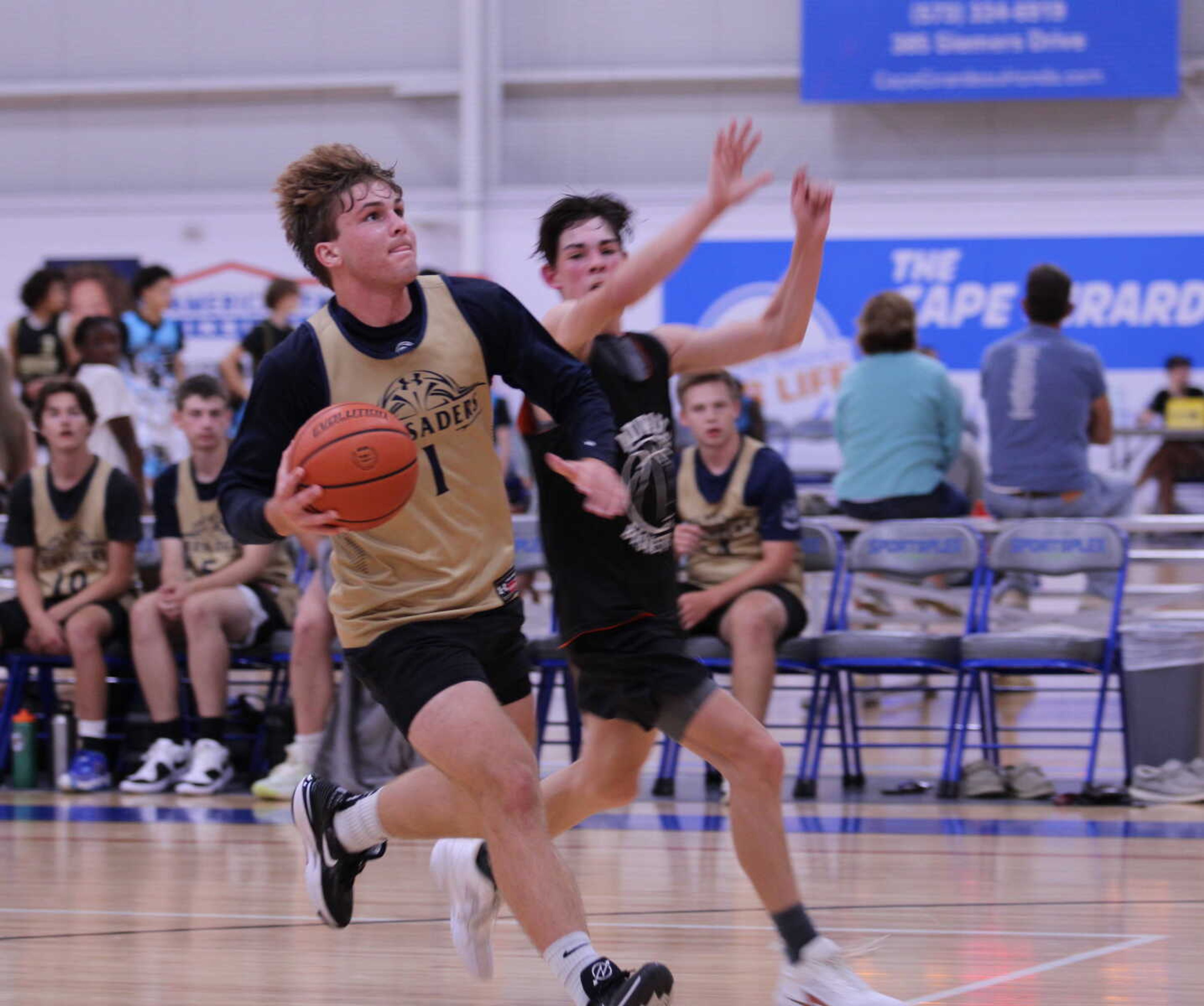 Saxony's Owen Buchheit drives toward the basket during a summer league game against Advance on June 18.