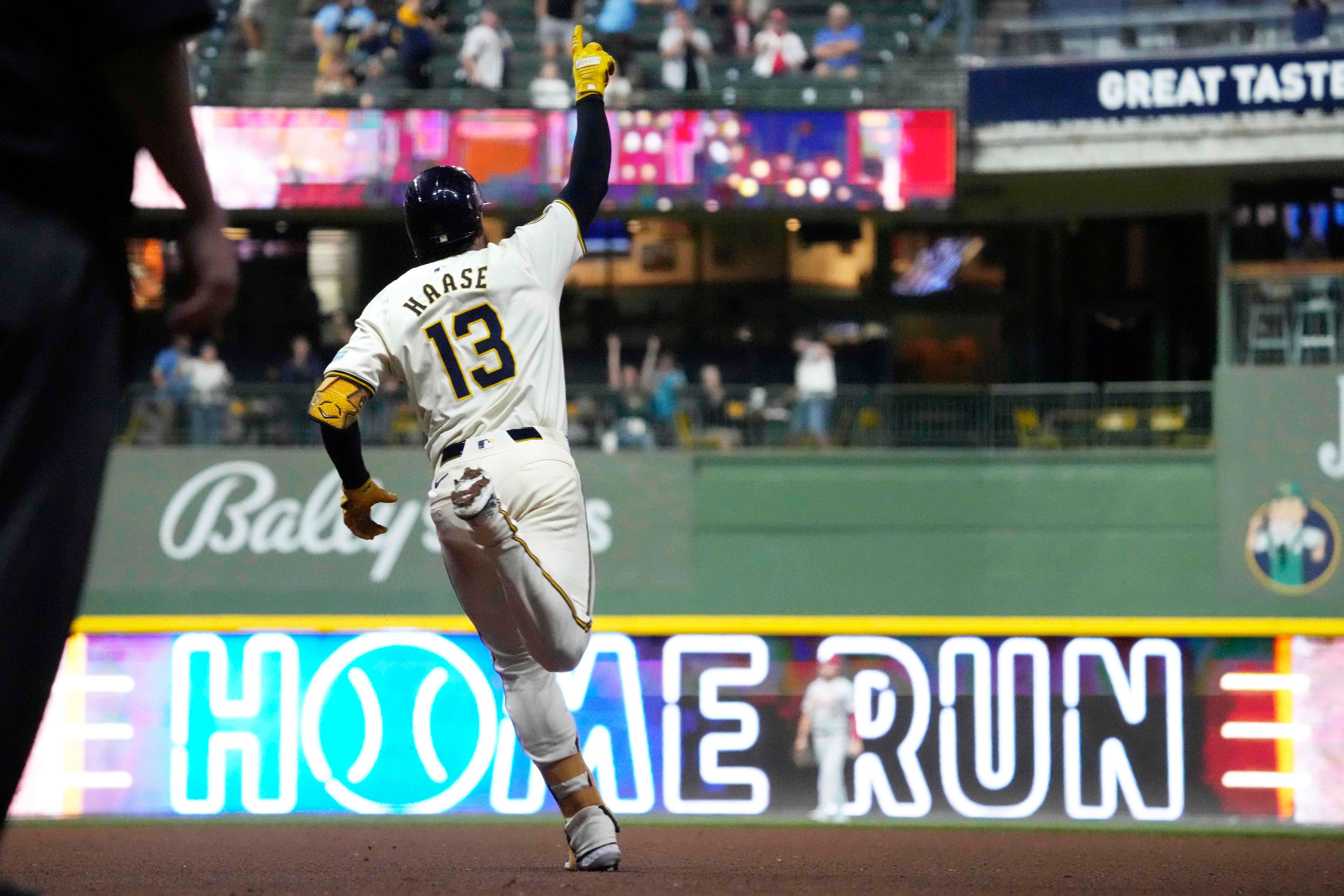 Milwaukee Brewers' Eric Haase celebrates after hitting a home run in the eighth inning of a baseball game against the St. Louis Cardinals, Wednesday, Sept. 4, 2024, in Milwaukee. (AP Photo/Kayla Wolf)