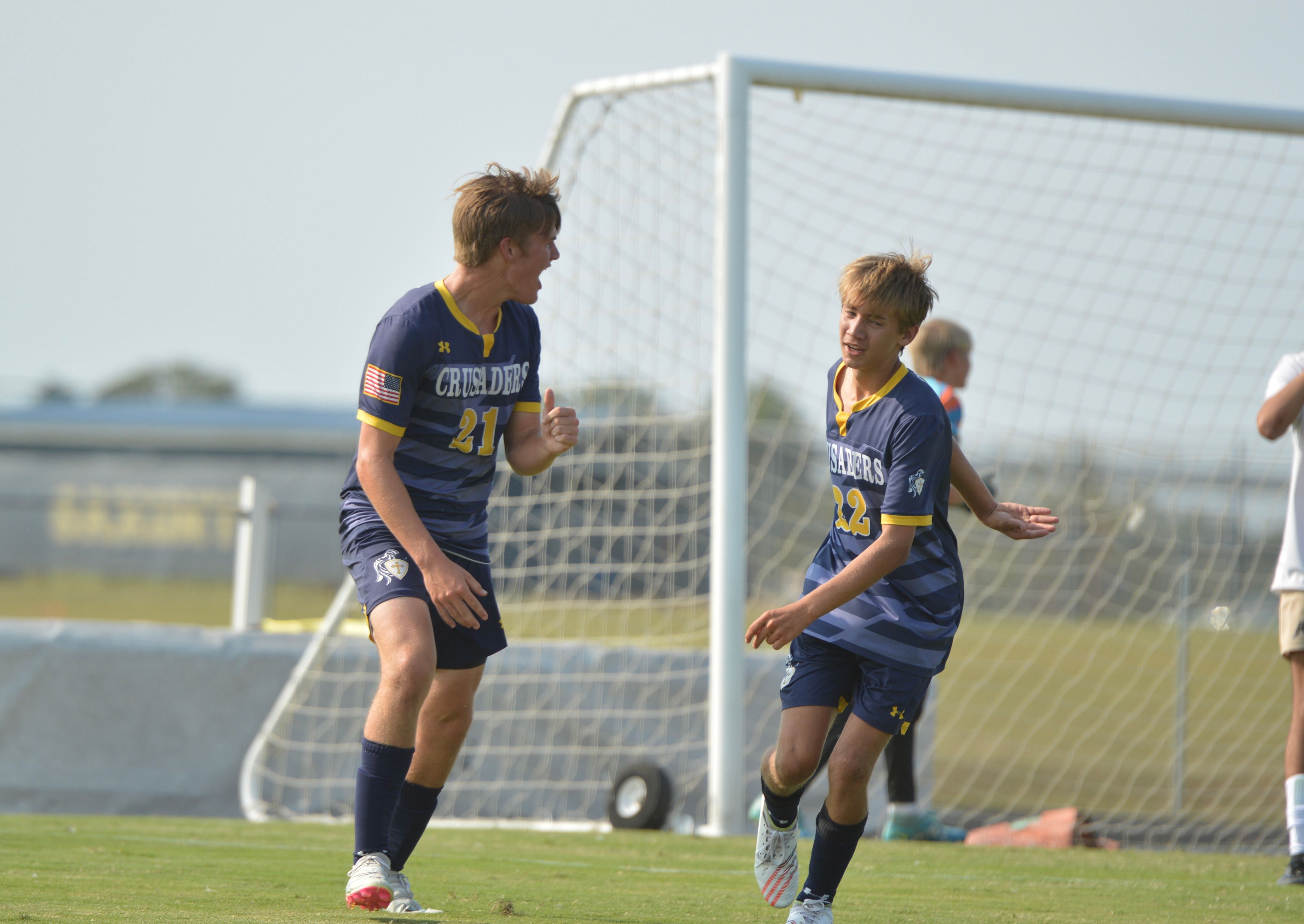 Saxony Lutheran sophomore Nick Chambless, left, celebrates a match-opening goal with his teammate against Fredericktown on Tuesday, Sept. 10.