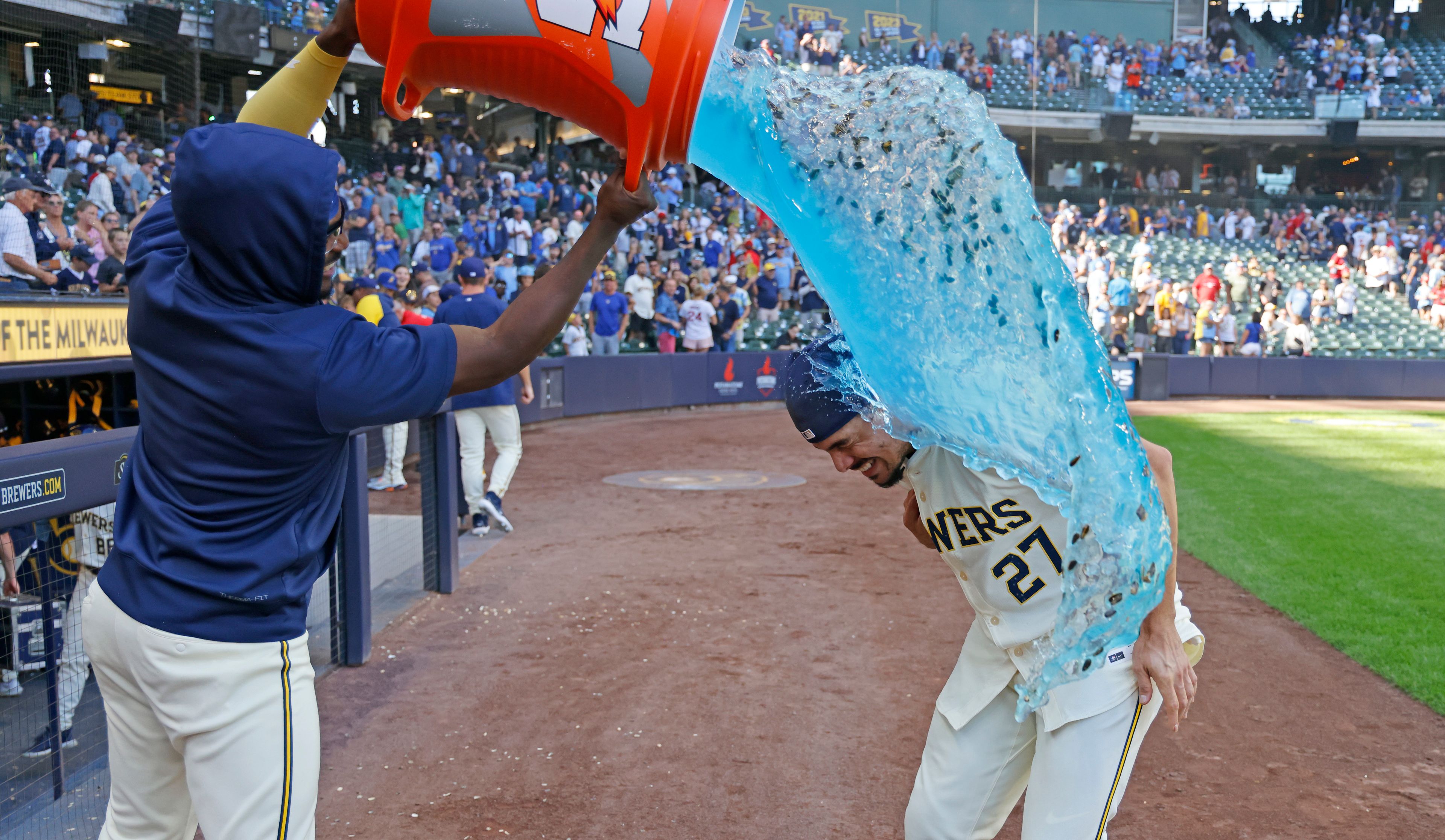 Milwaukee Brewers' Willy Adames, right, is doused after a baseball game against the St. Louis Cardinals, Monday, Sept. 2, 2024, in Milwaukee. (AP Photo/Jeffrey Phelps)