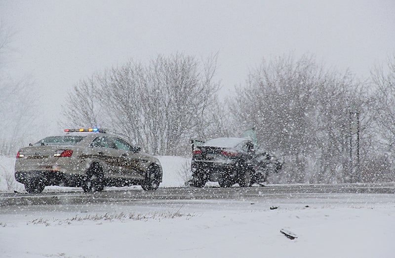 Updated: One fatality in snowy crash between car and semi