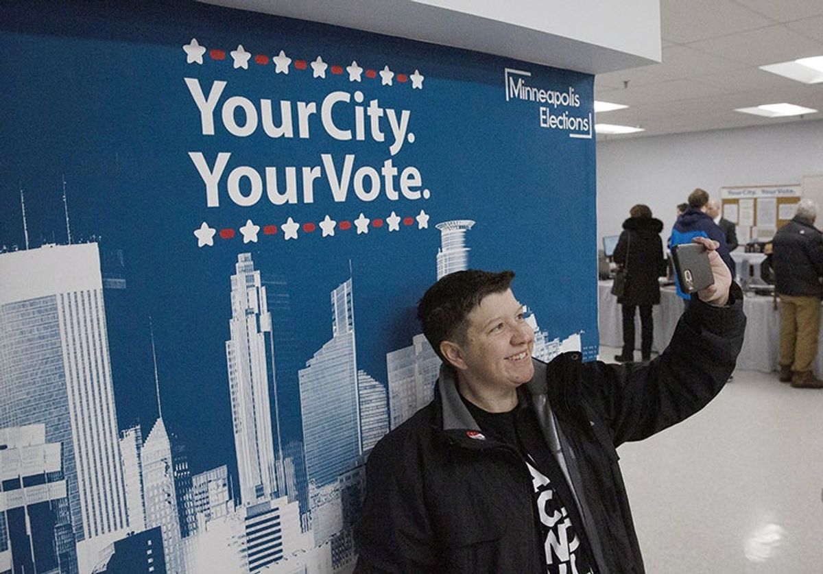 Enthusiastic early voters camp out, rally for their presiden...