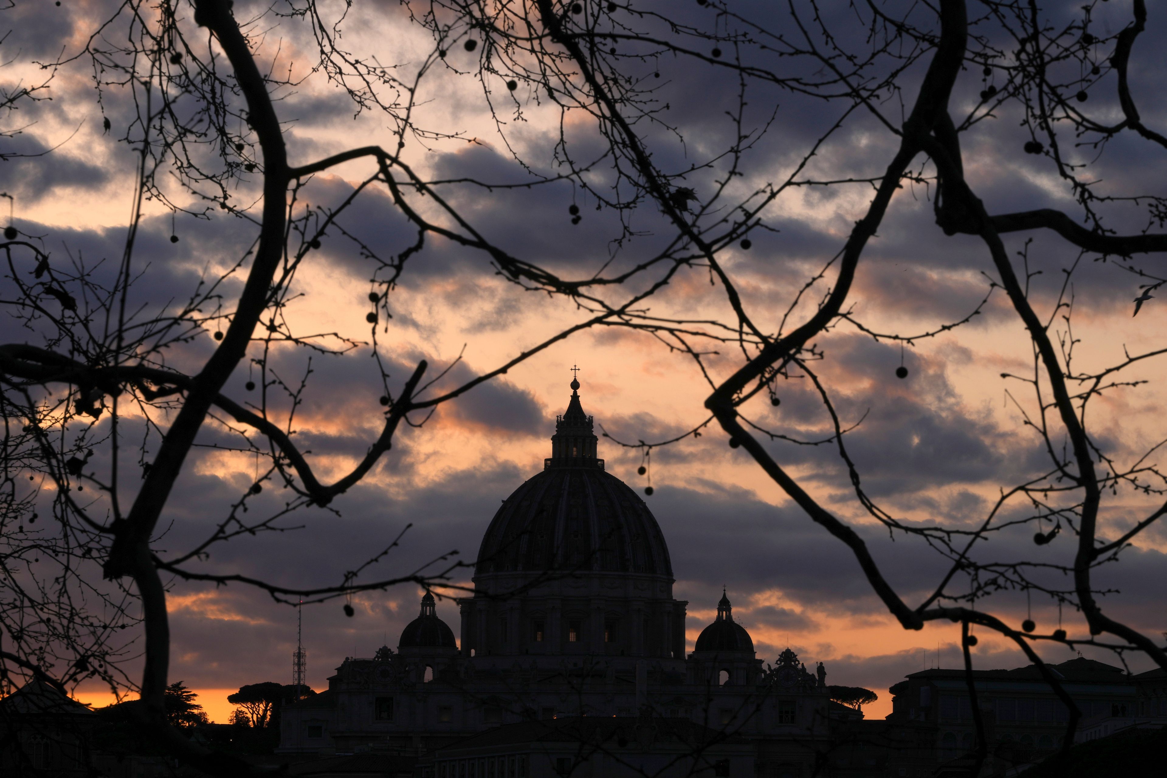 Dark clouds hover over St Peter's Basilica at the Vatican in Rome, Sunday, March 2, 2025. (AP Photo/Kirsty Wigglesworth)