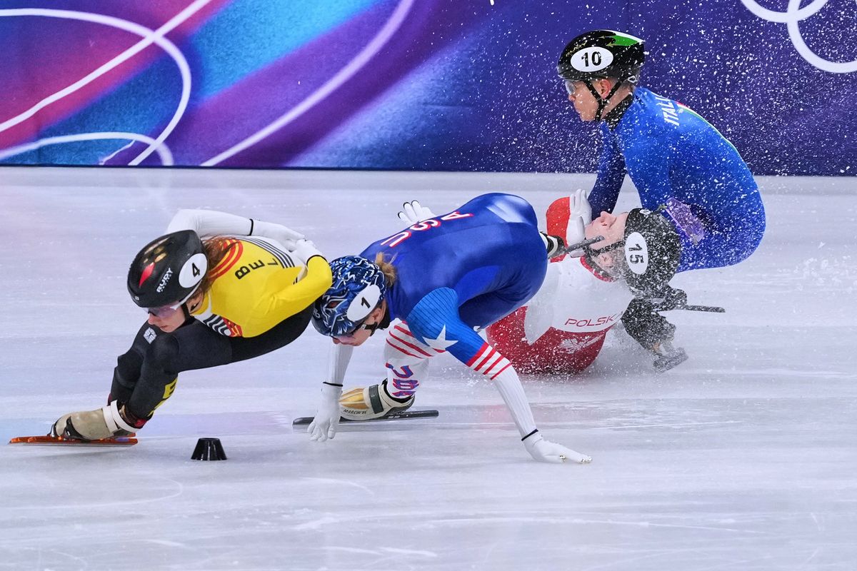 Polish speedskater Sellier cut by opponent's bade, stretchered off at the Winter Olympics, in photos